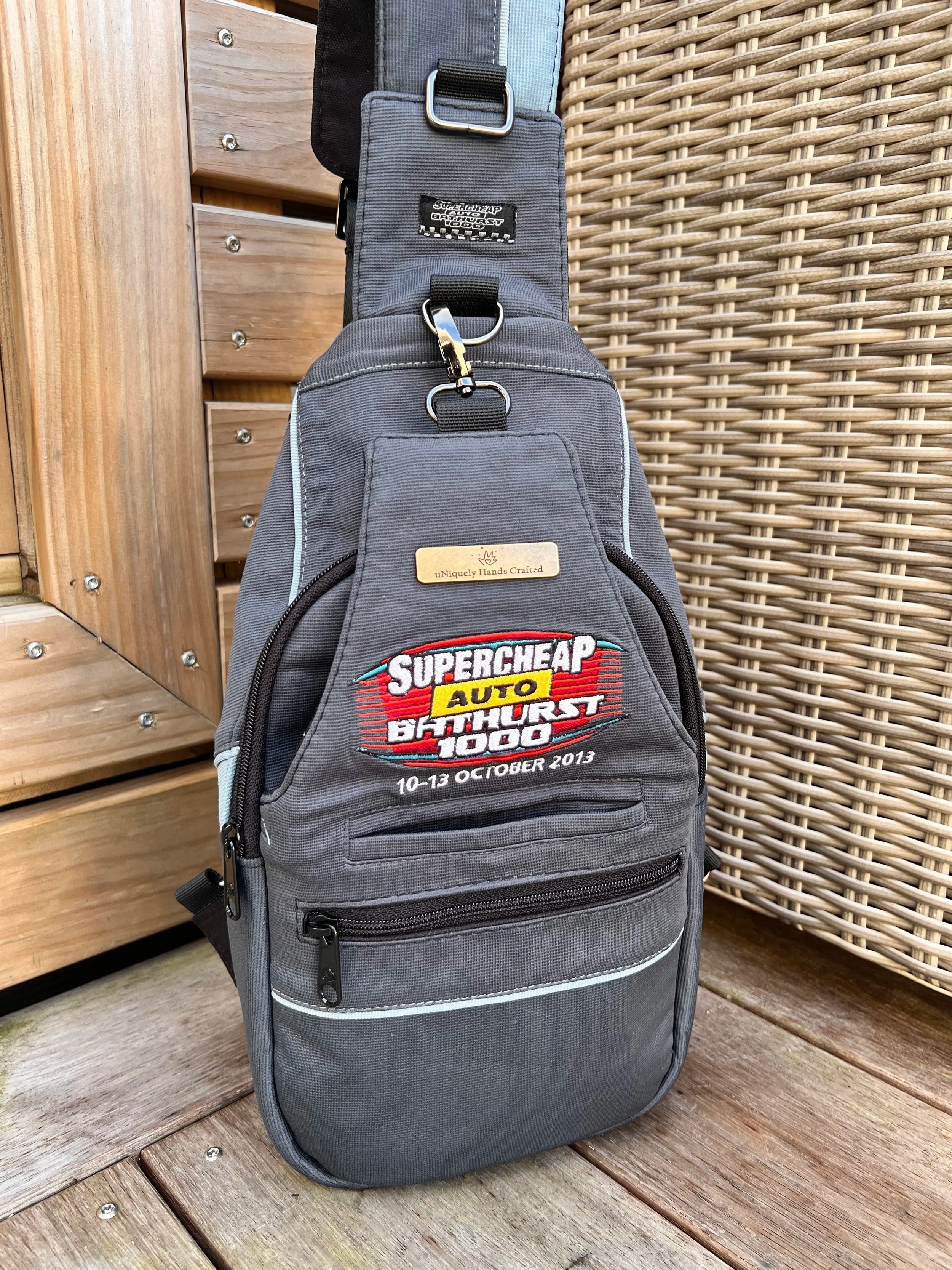 Custom handcrafted sports jersey bag created from a treasured 2013 Bathurst motorsport jersey, as part of the Legacy Re-Crafted Collection.