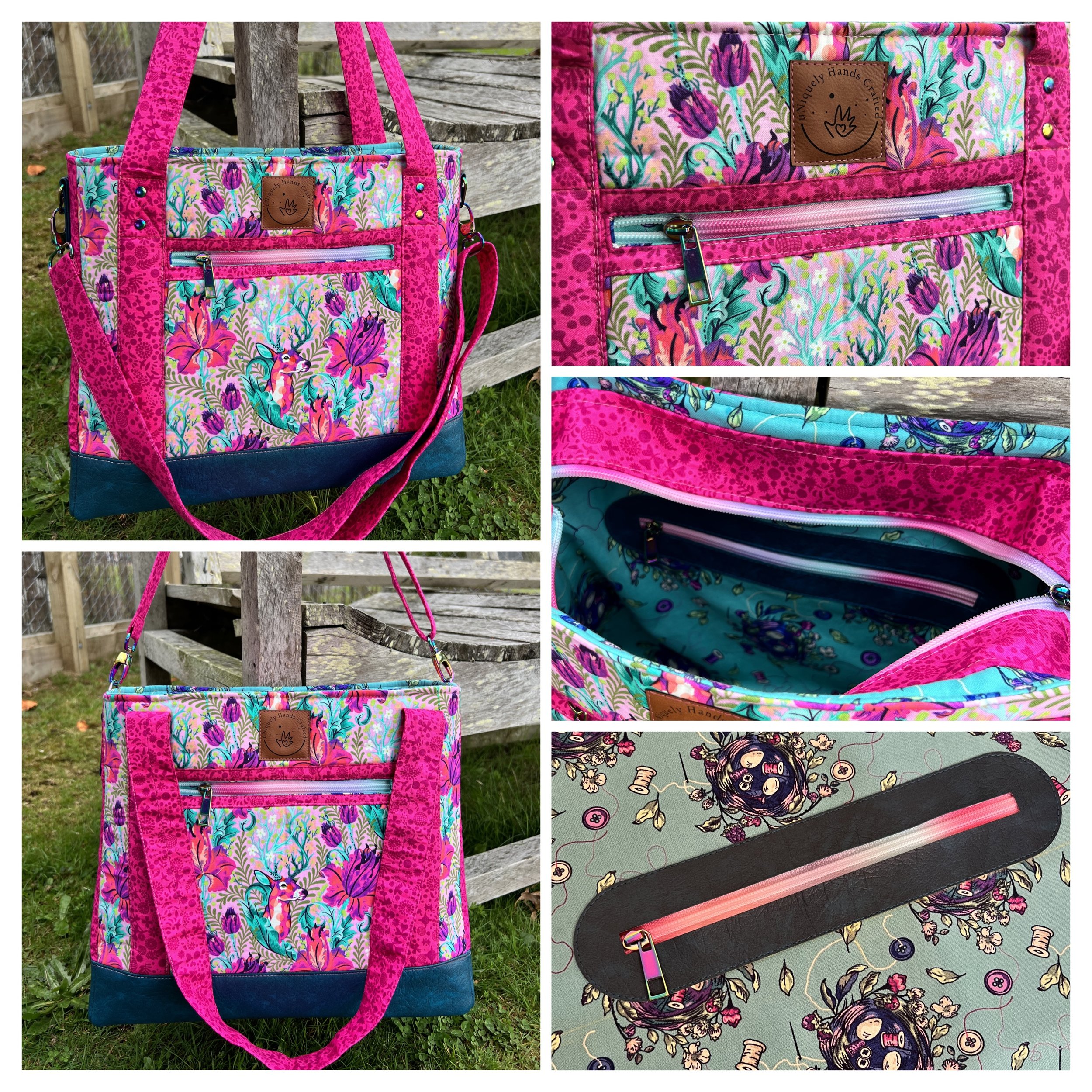 A colorful tote bag with a floral and animal print, featuring pink, blue, and purple hues, hanging on a wooden fence and showing detailed interior compartments with zippers.