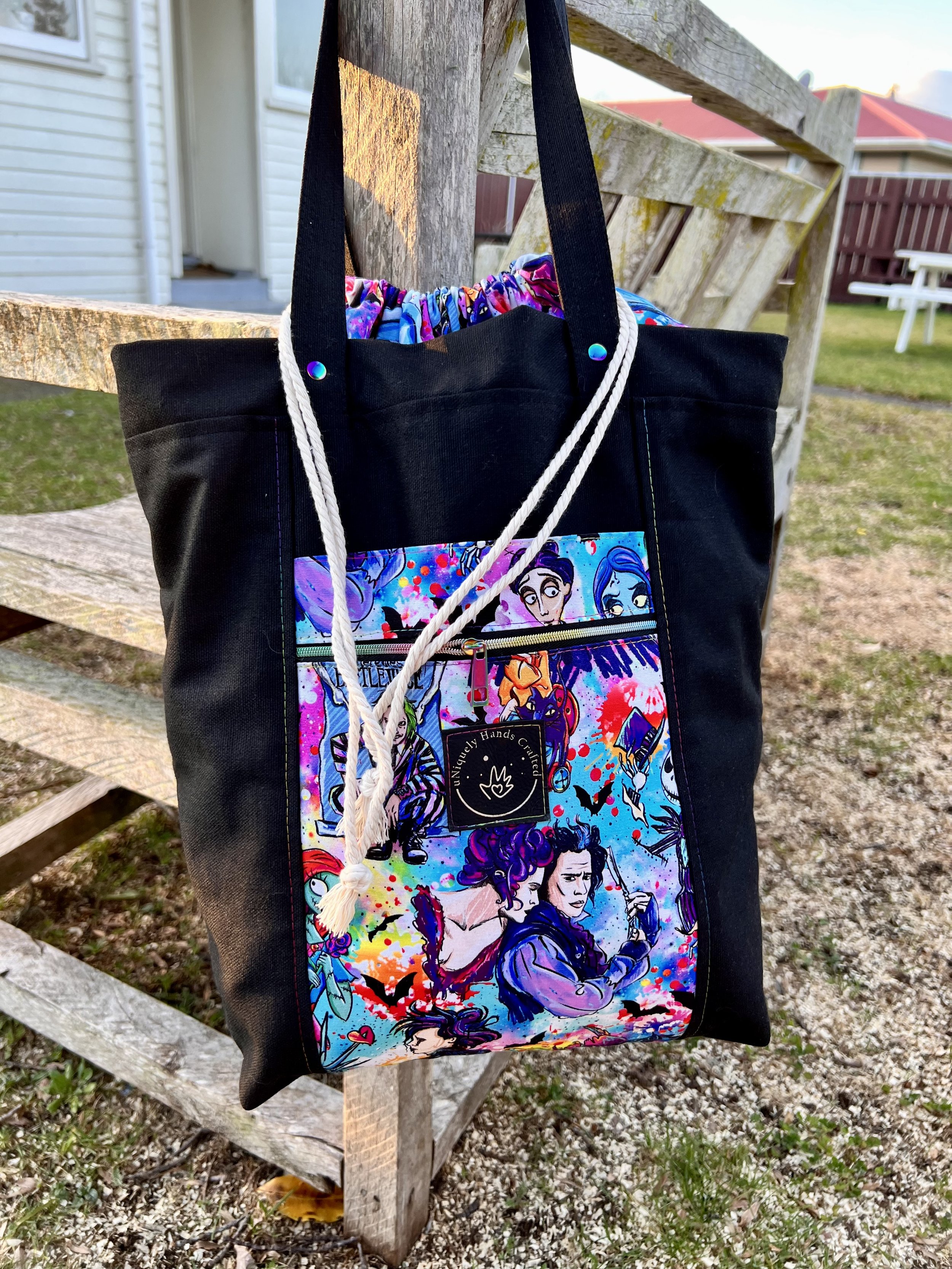 Custom handcrafted bag featuring illustrated characters and imagery from multiple Tim Burton films, from the uNiquely Hands Crafted Collection.