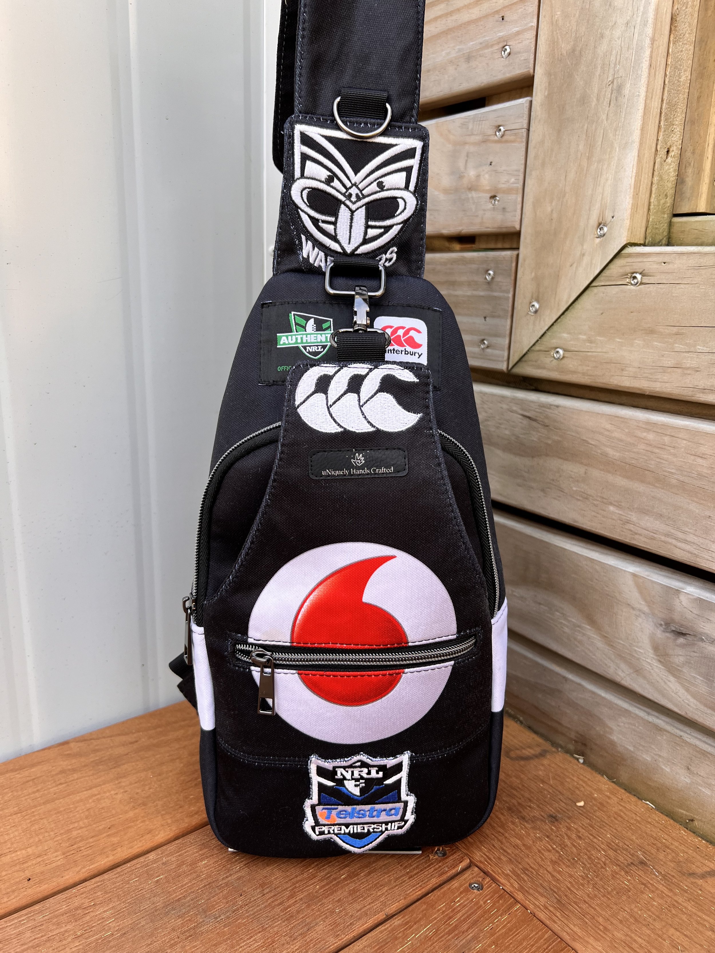 Handcrafted bag created from a treasured New Zealand Warriors rugby league jersey, preserving the original team colours, logos and jersey details