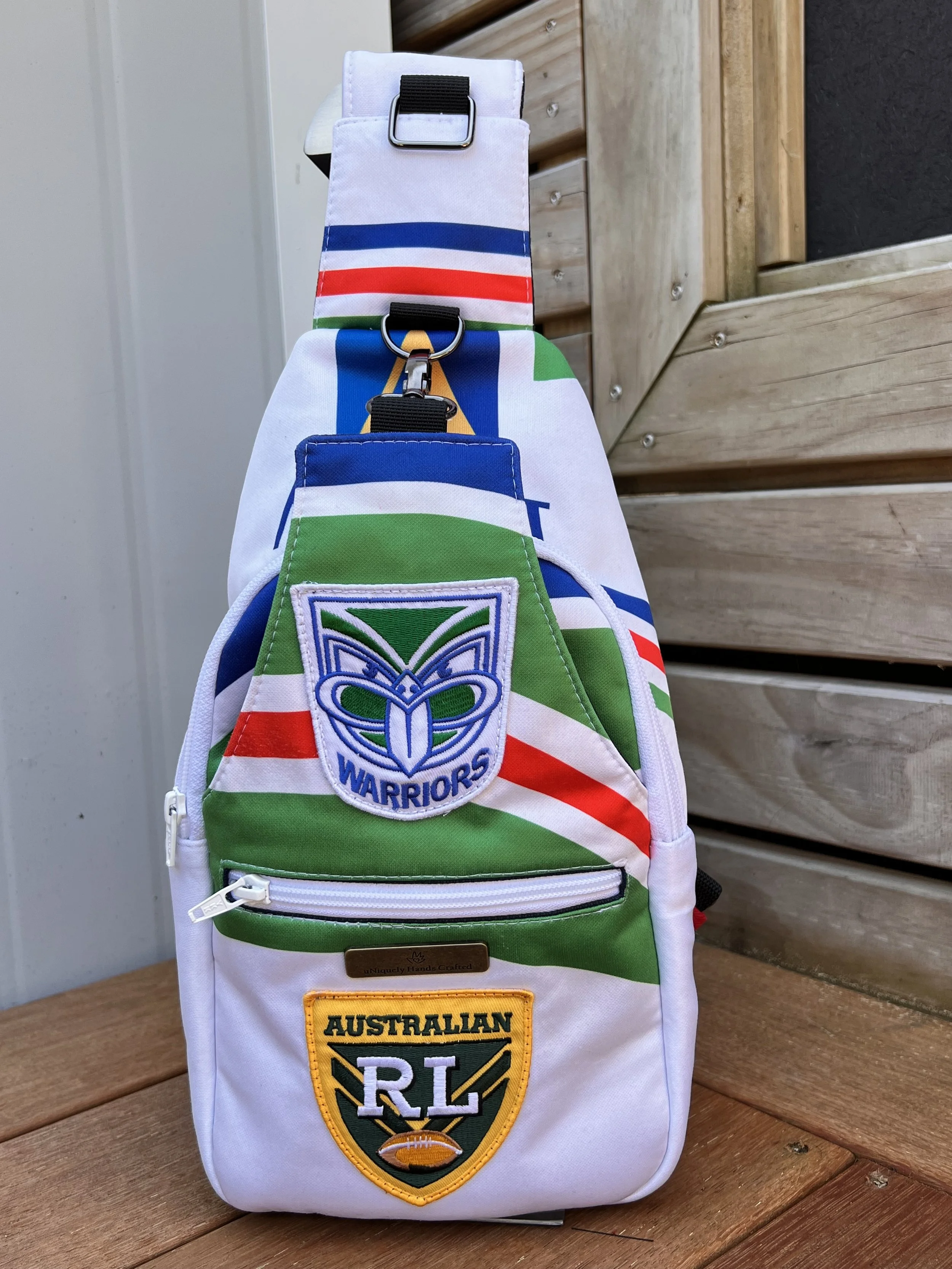 Handcrafted bag created from a treasured New Zealand Warriors rugby league jersey, preserving the original team colours, logos and jersey details.