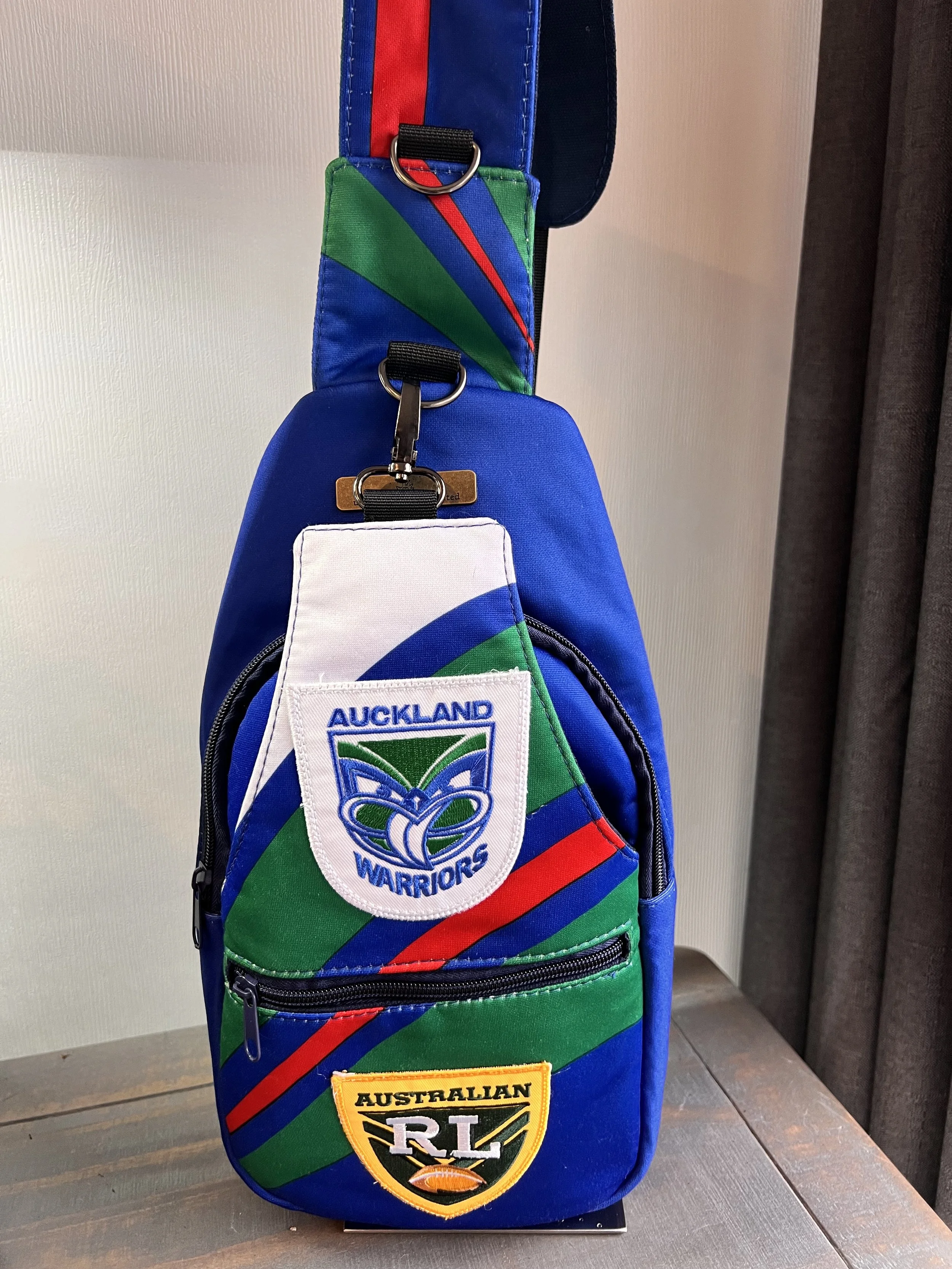 Handcrafted bag created from a treasured New Zealand Warriors rugby league jersey, preserving the original team colours, logos and jersey details