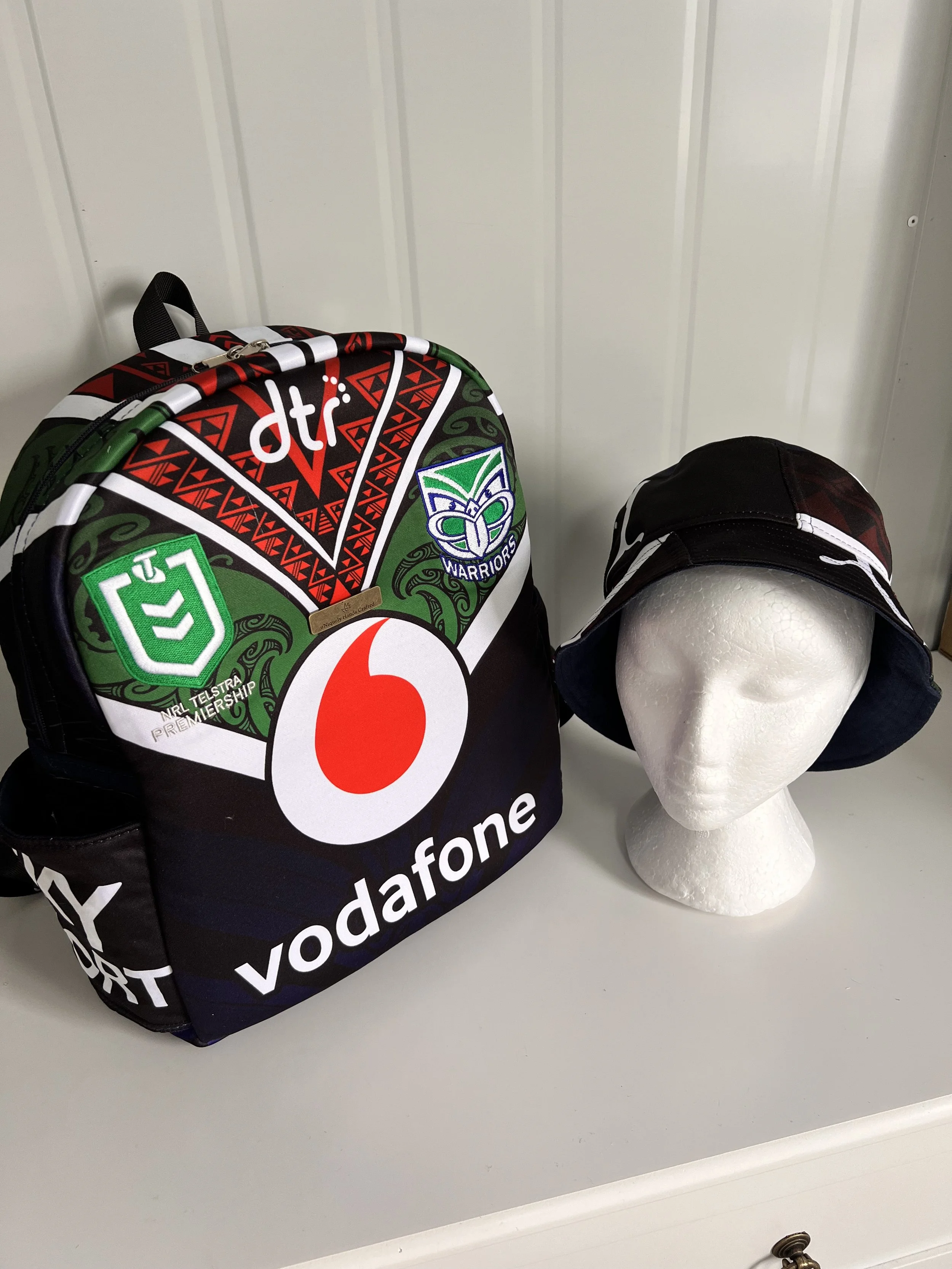 Handcrafted bag created from a treasured New Zealand Warriors rugby league jersey, preserving the original team colours, logos and jersey details