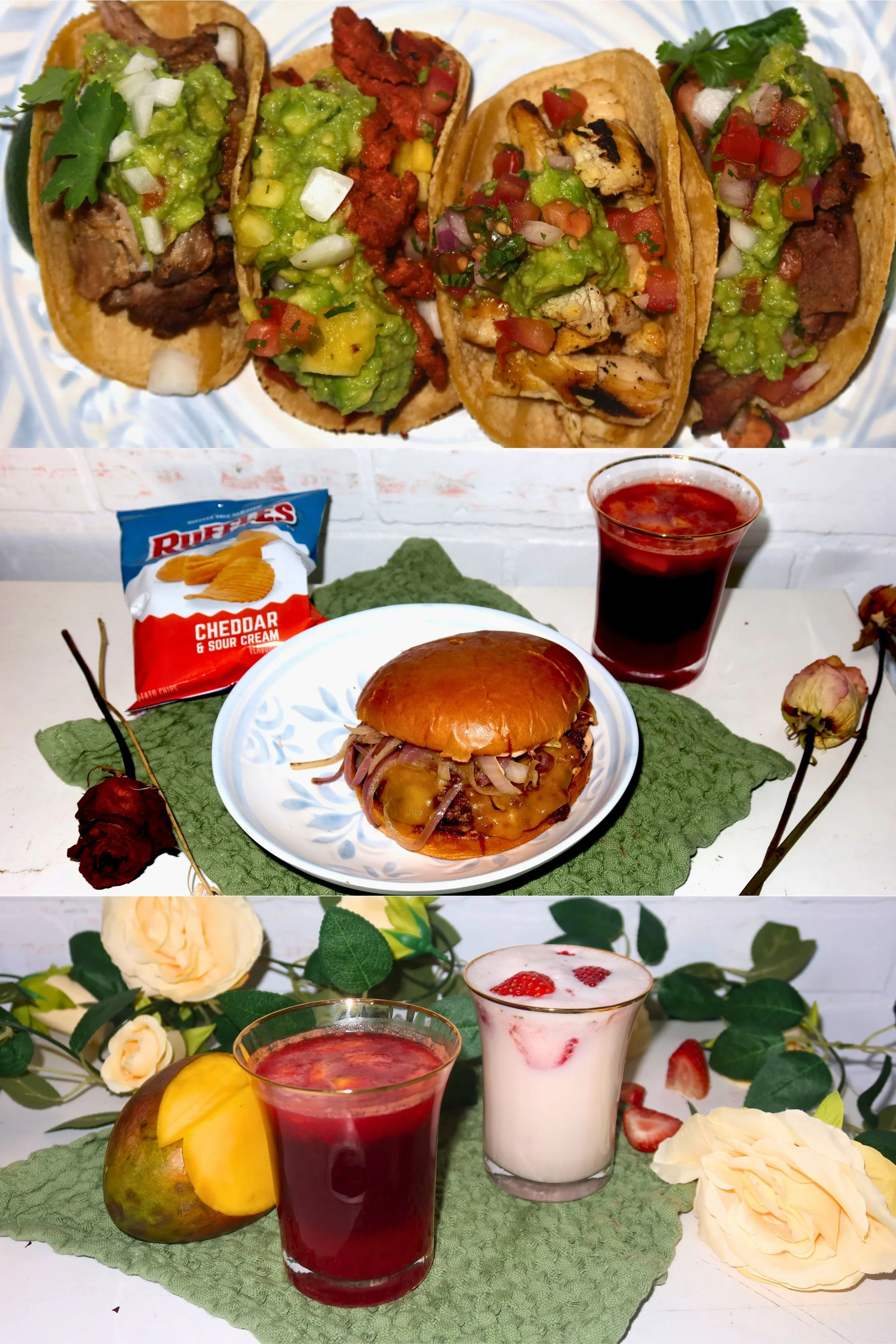 A collection of food and drinks displayed on a table. The top row features four tacos with various fillings, topped with guacamole, chopped onions, tomatoes, and cilantro. The middle row contains a burger with toppings, a bag of cheddar and sour cream potato chips, a glass of red beverage, and a bun. The bottom row shows two glasses of strawberry or berry-flavored drinks garnished with fruit slices and surrounded by cream-colored roses and greenery.