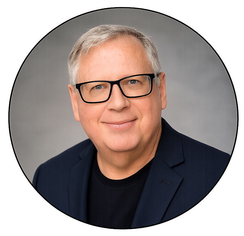 Portrait of Allen J. Woppert, an older man with gray hair and glasses, a blue blazer and black t-shirt