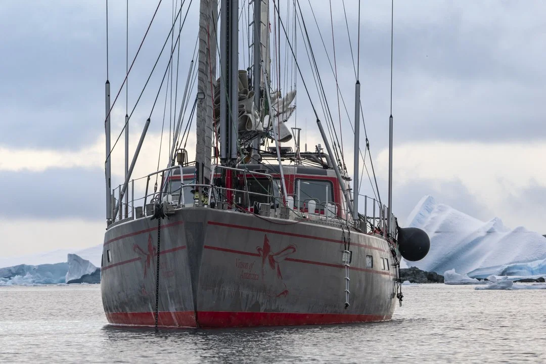 Polar expedition yacht anchored in Antarctica during a wildlife photography expedition.