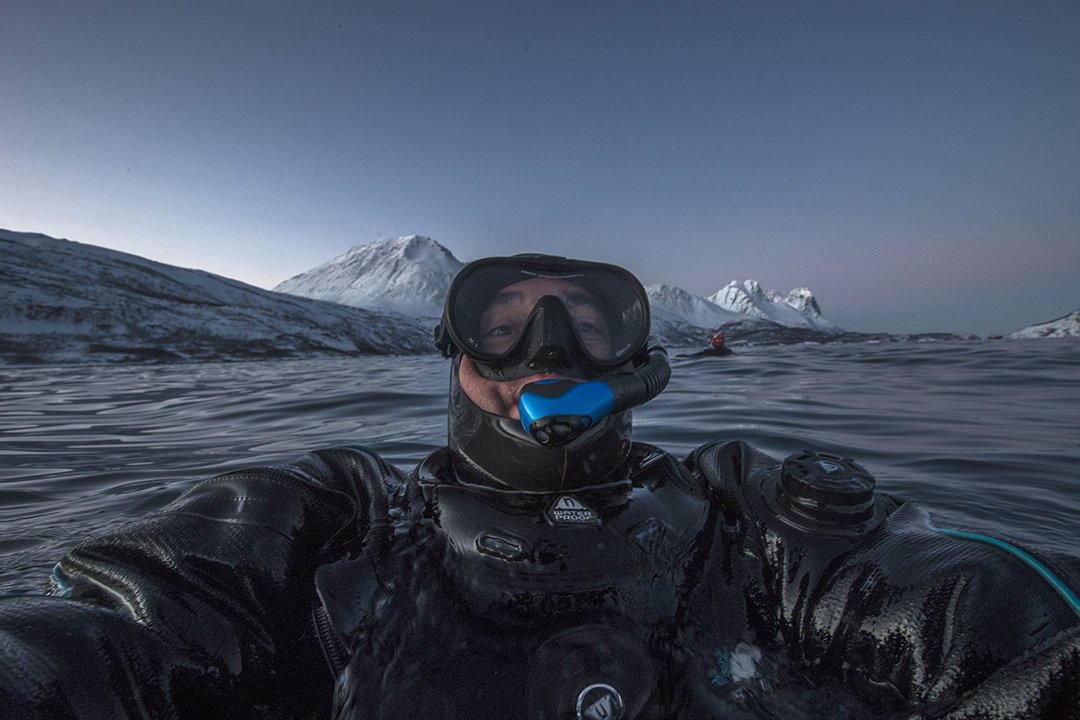 Scott Portelli cold-water diving in an expedition drysuit during a Northern Norway wildlife photography expedition.