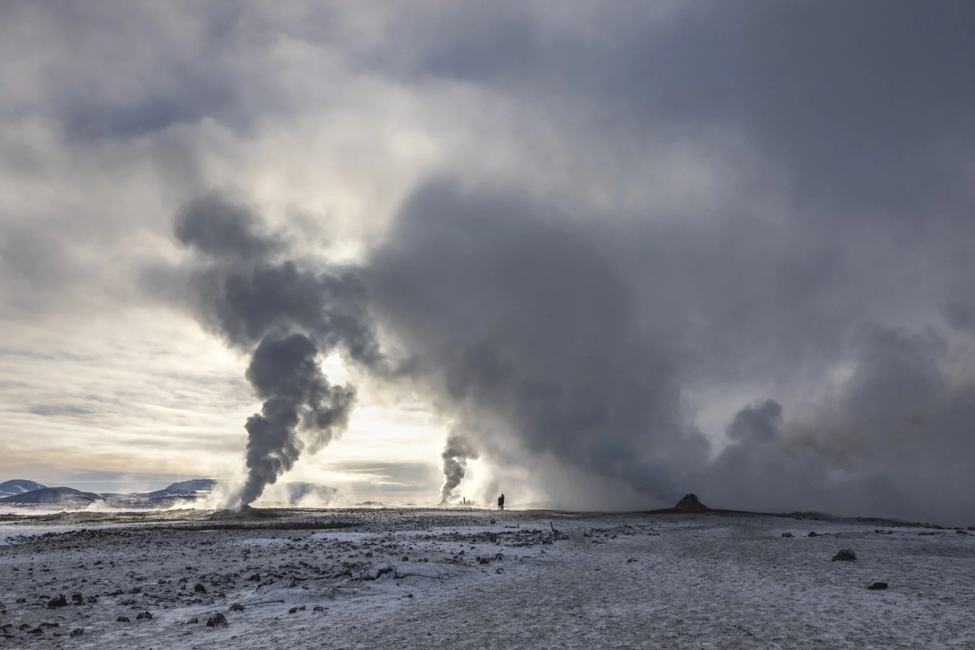Steam rising from geothermal vents in the volcanic landscapes of Iceland.
