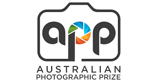 Logo of the Australian Photographic Prize with the initials 'app' and a colorful circular camera aperture