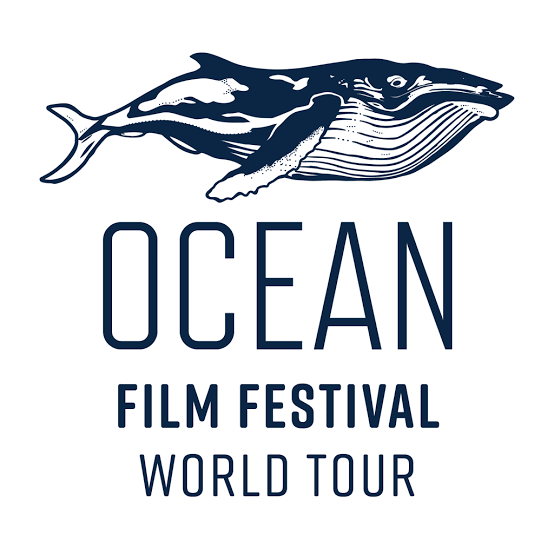 Logo for the Ocean Film Festival World Tour featuring a stylized whale with a whale tail and fish along its body, with the text 'OCEAN FILM FESTIVAL WORLD TOUR' beneath.