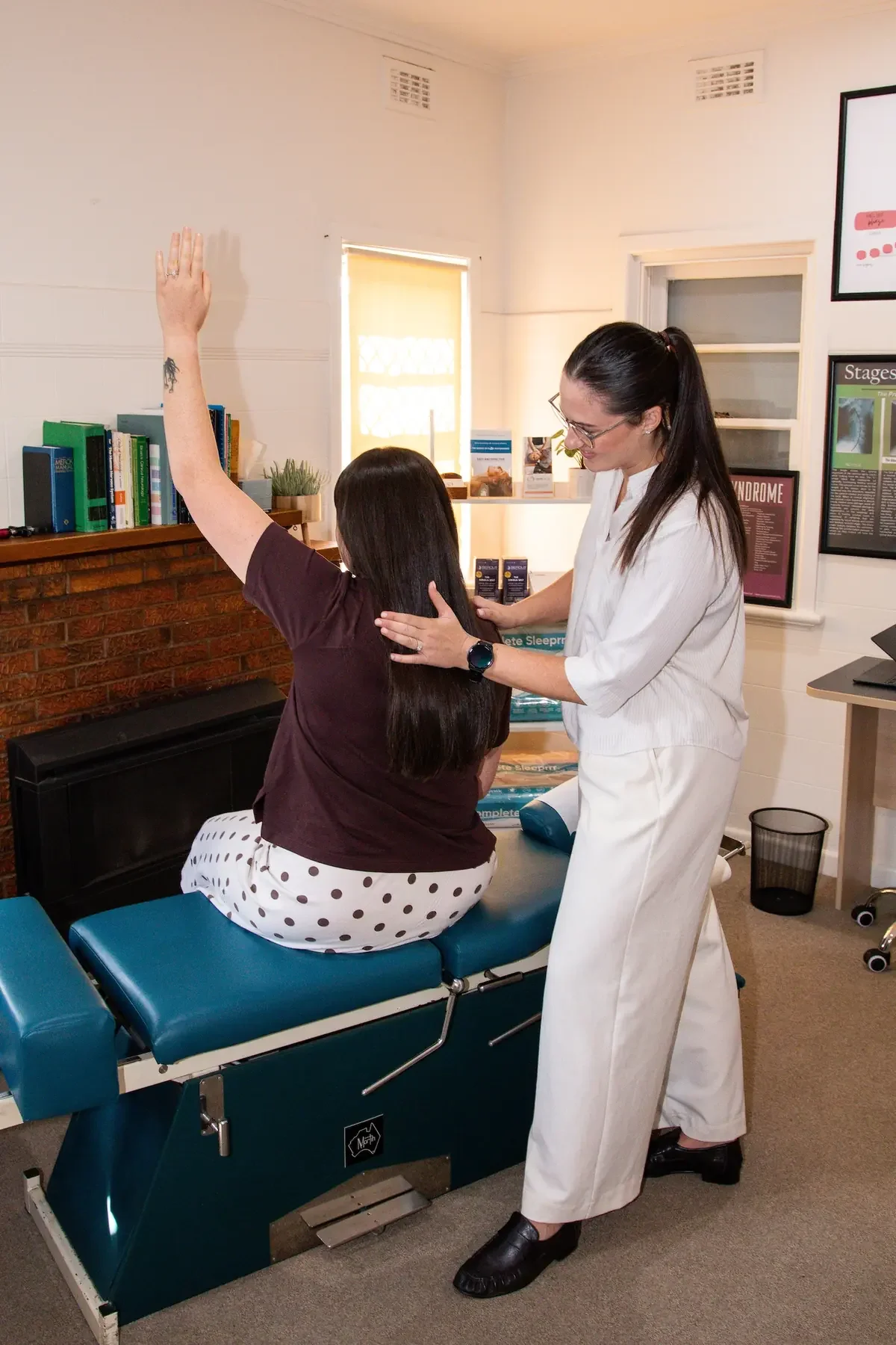 Dr Tia Deoki chiropractor working with shoulder pain
