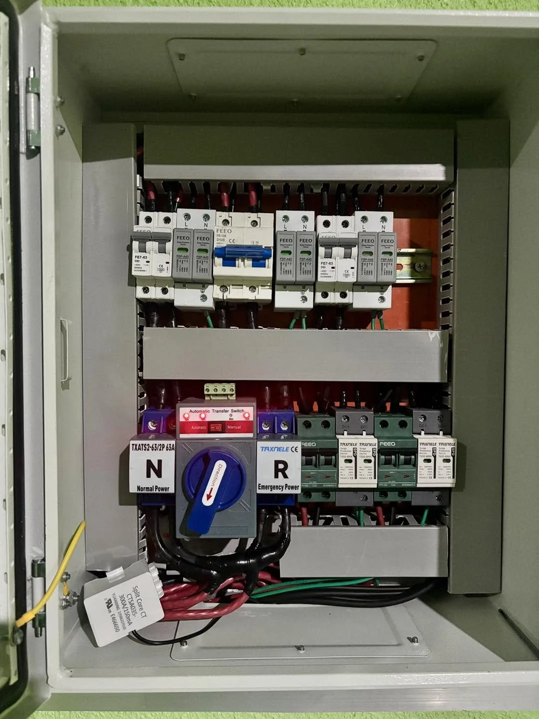 Electrical control panel with circuit breakers, switches, and wiring.