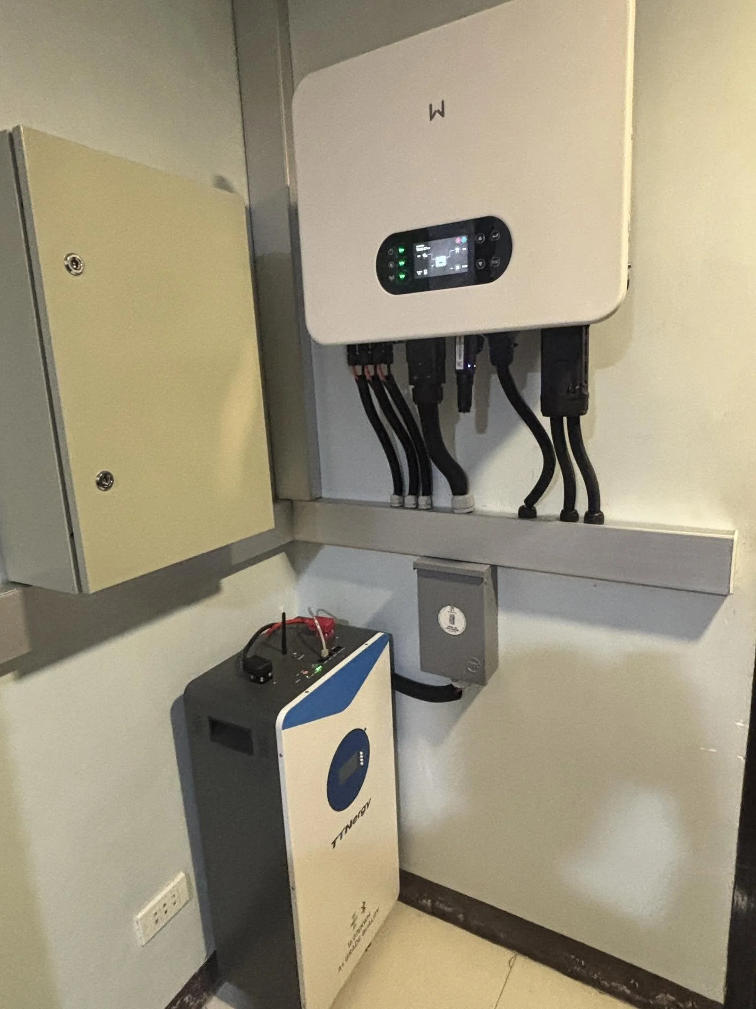 Electric vehicle charging station and related equipment in an indoor setting.