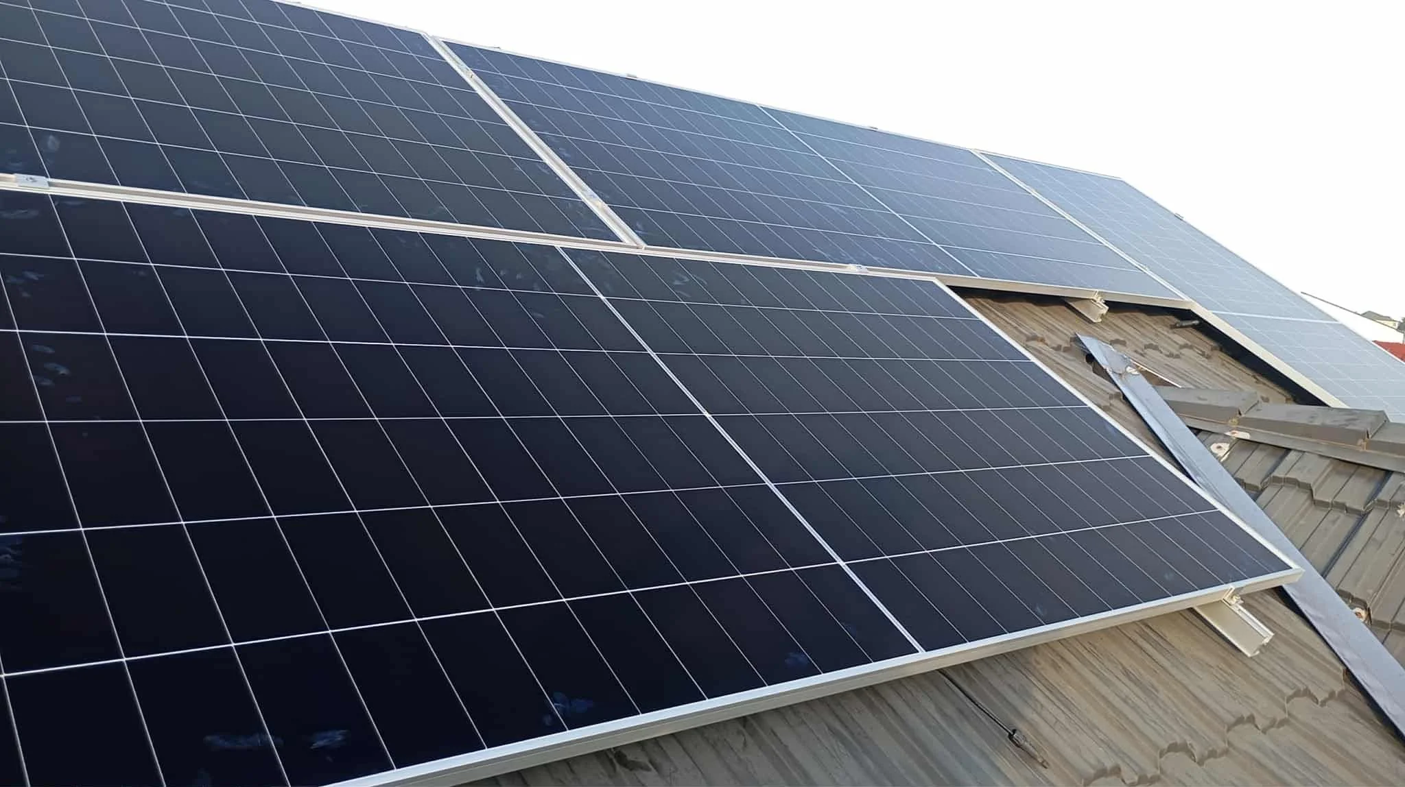 Close-up of solar panels installed on a rooftop.
