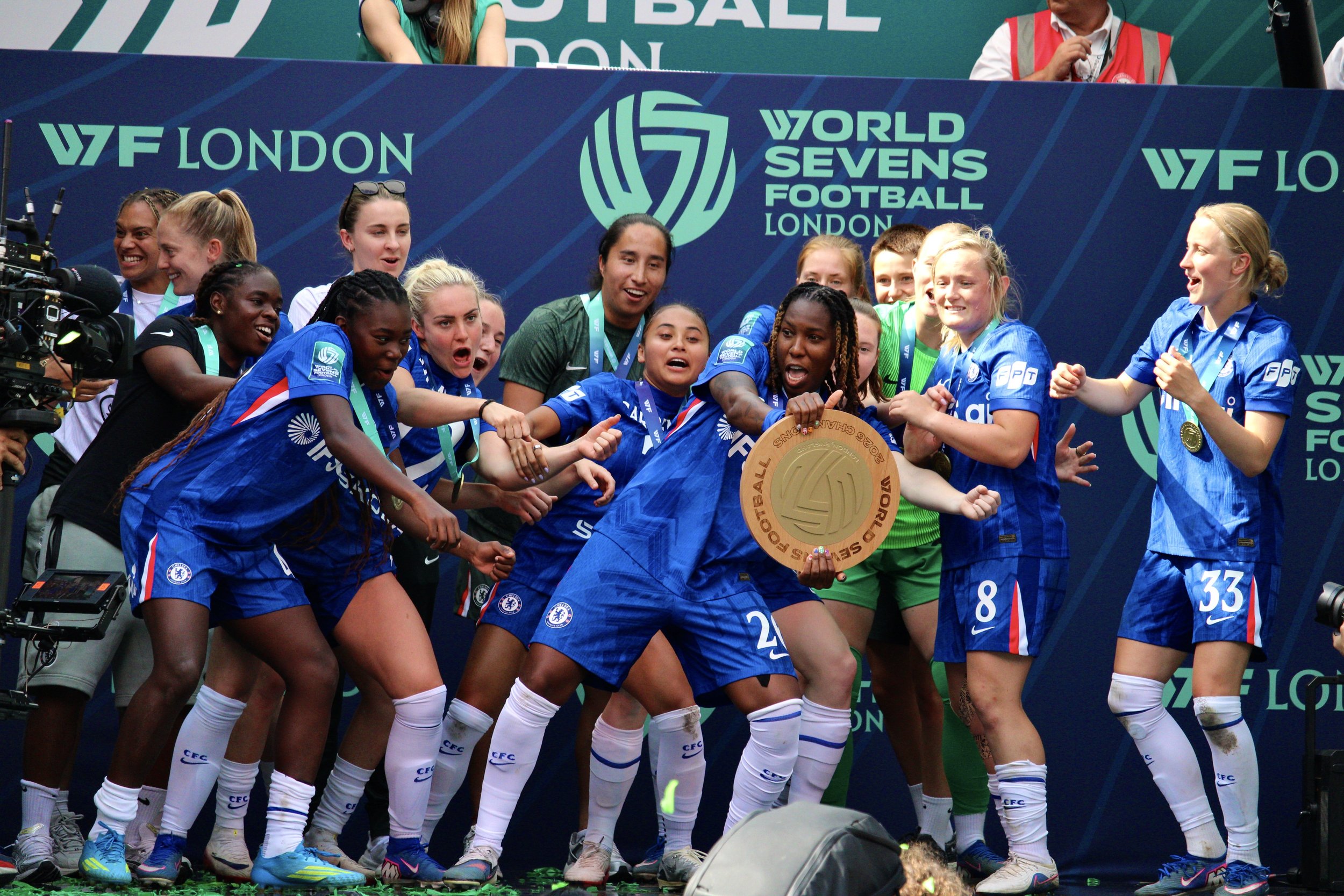 Kadeisha Buchanan uses the trophy as a steering wheel.