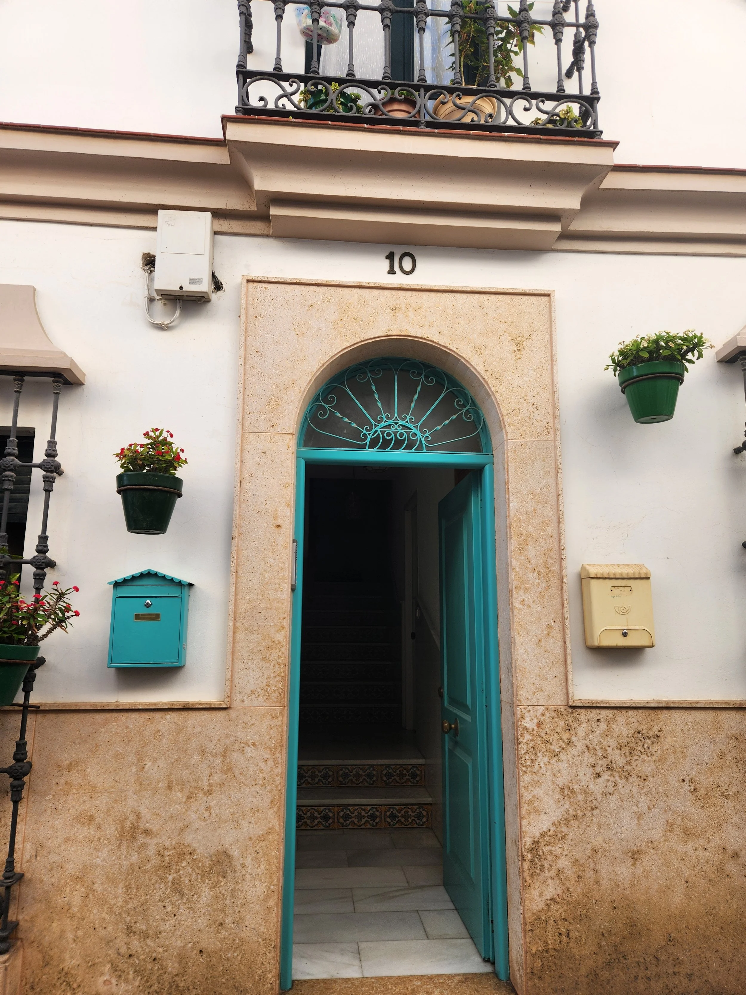 An open door in Spain representing openness, curiosity, and exploration.