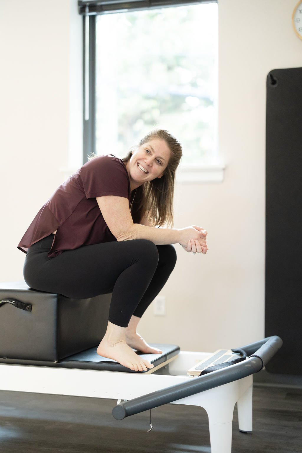 Dara Galasso smiling while teaching a Pilates session