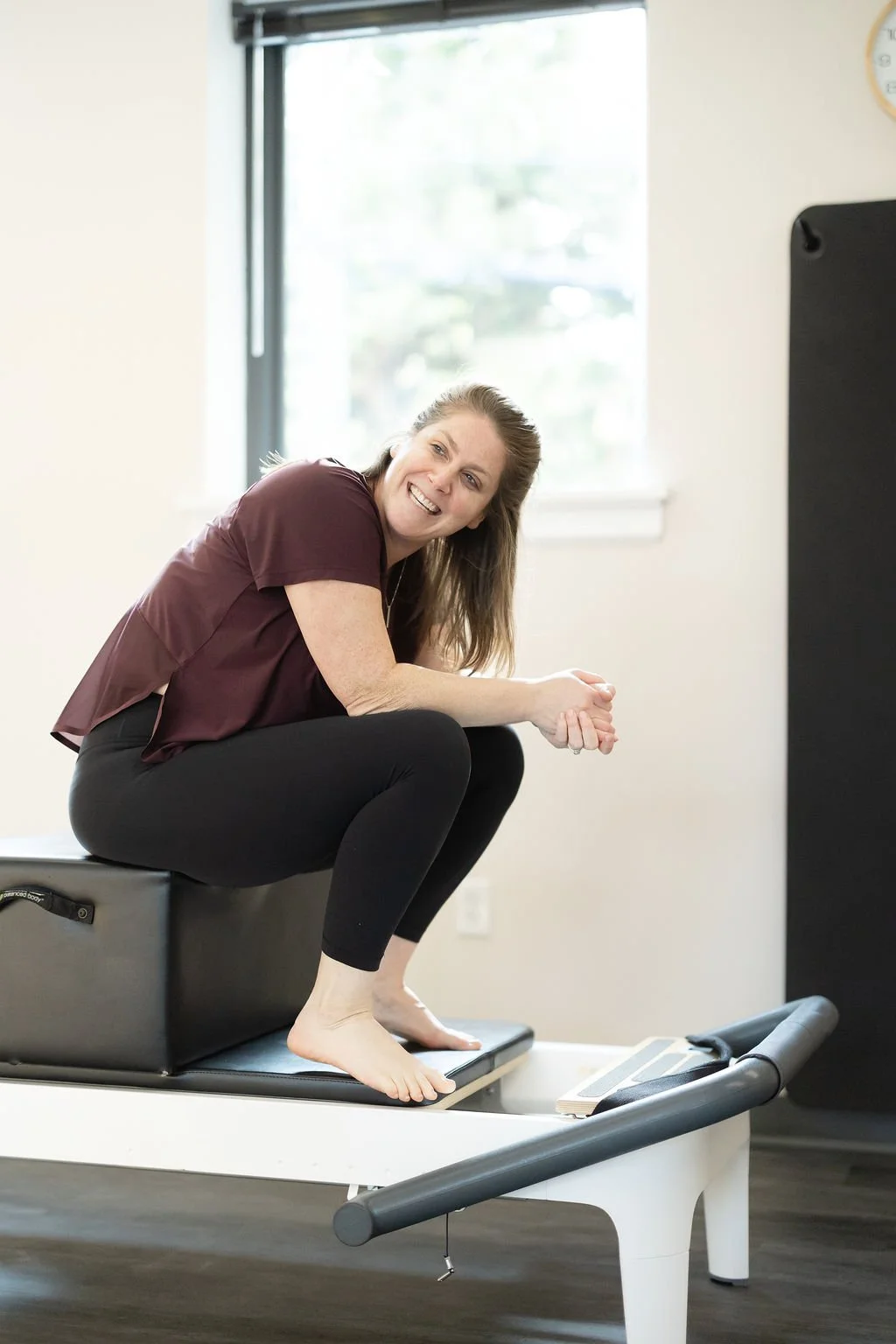 Dara Galasso smiling while teaching a Pilates session