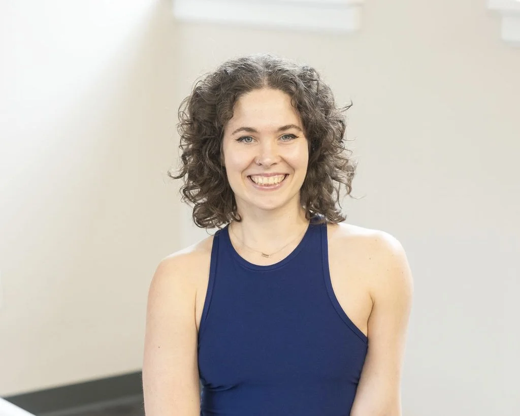 Pilates Plus instructor smiling in the studio
