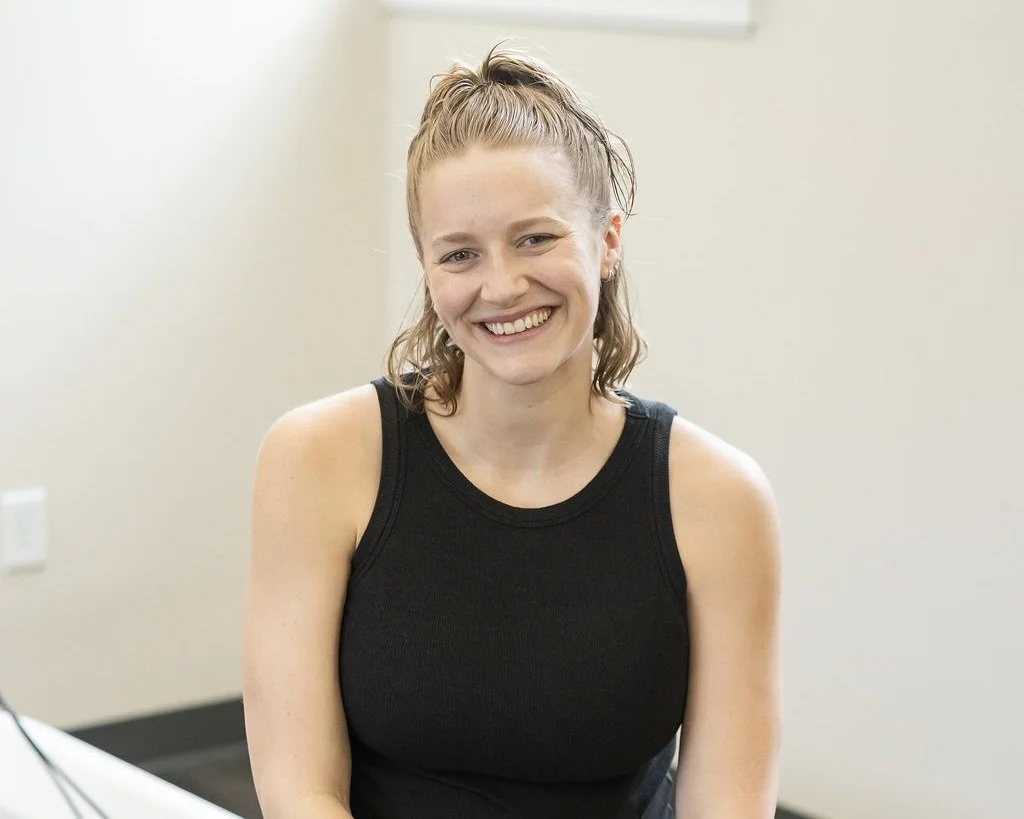 Pilates Plus instructor smiling in the studio
