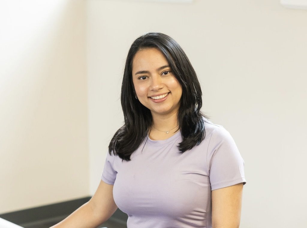Pilates Plus instructor smiling in the studio