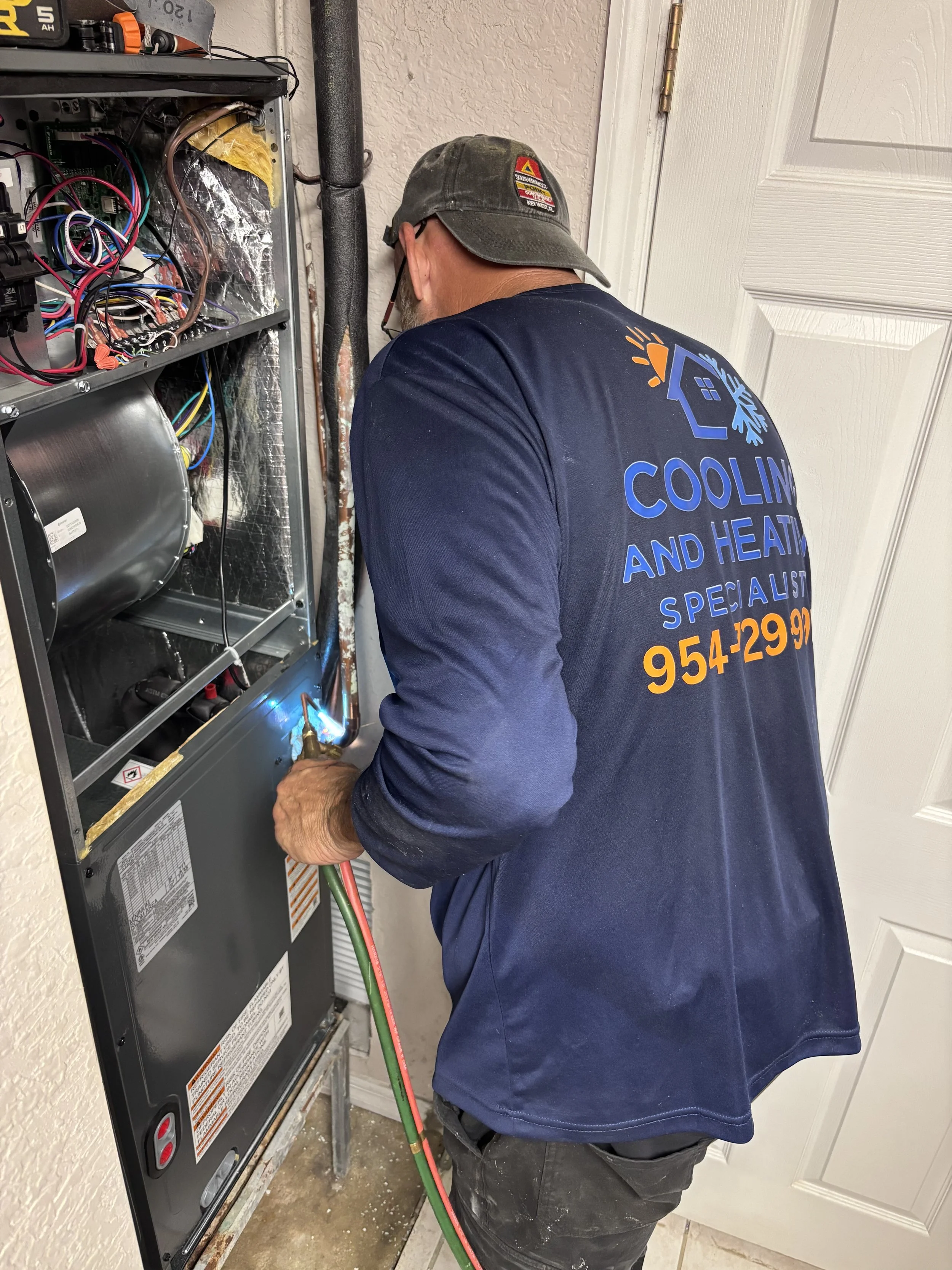 Cooling and Heating Specialists technician AC repair