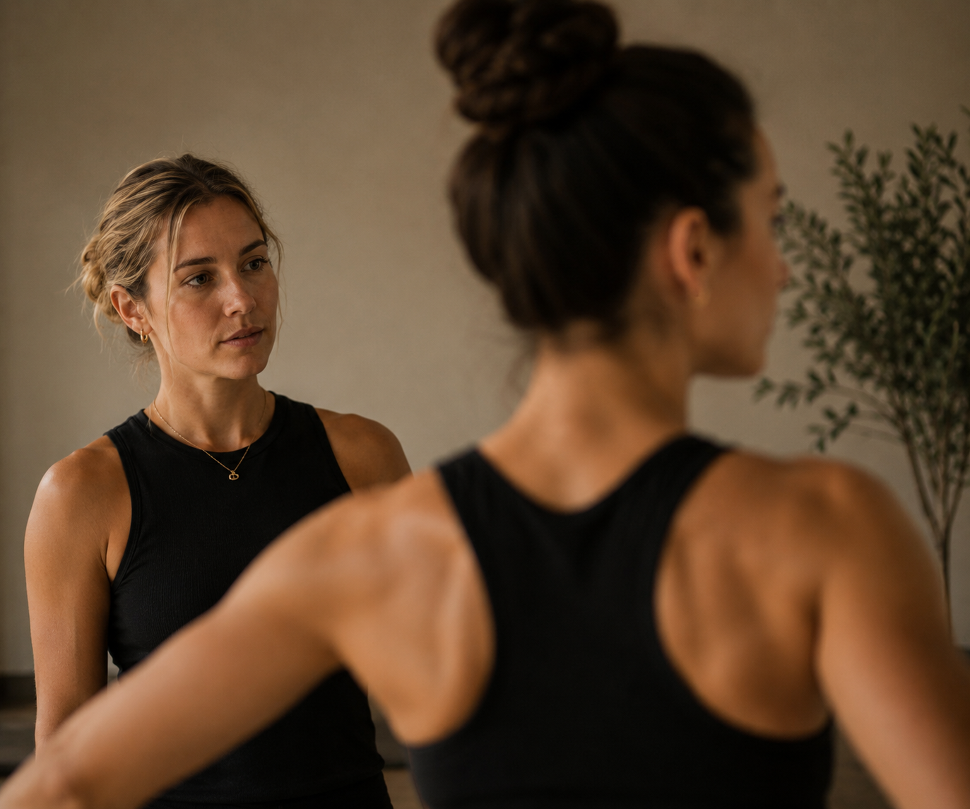 Pilates instructor developing movement observation skills to identify posture, compensation patterns, and functional movement during continuing education.