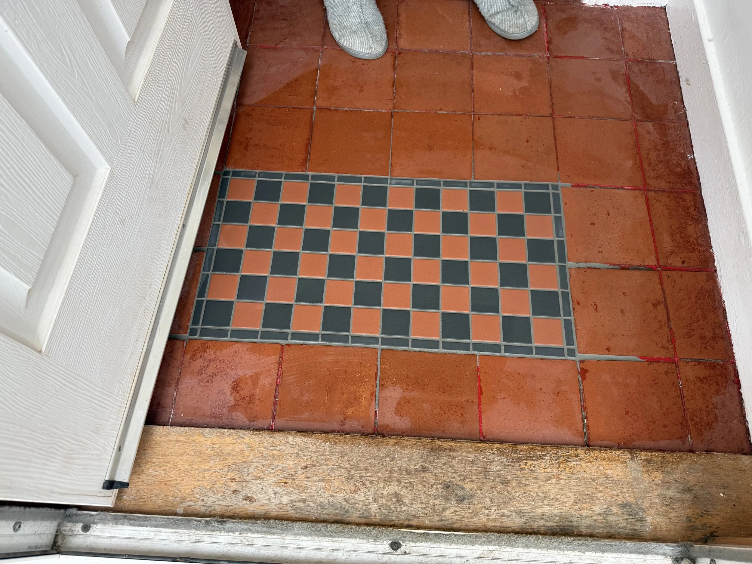 Tiling inset to fill an old doormat void