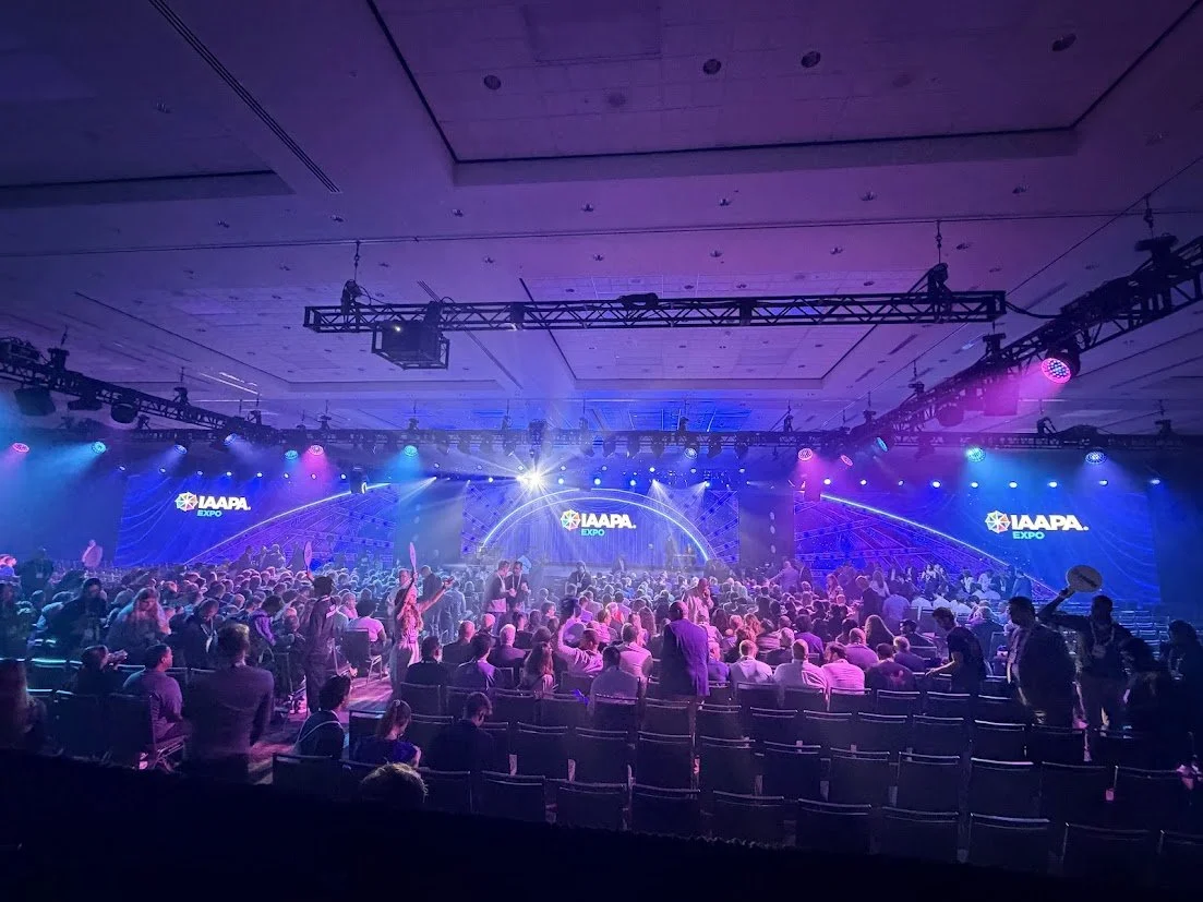 IAAPA Expo 2025 Main Content Stage with live audience, stage lighting, and large-scale event production by Knock Out Productions.