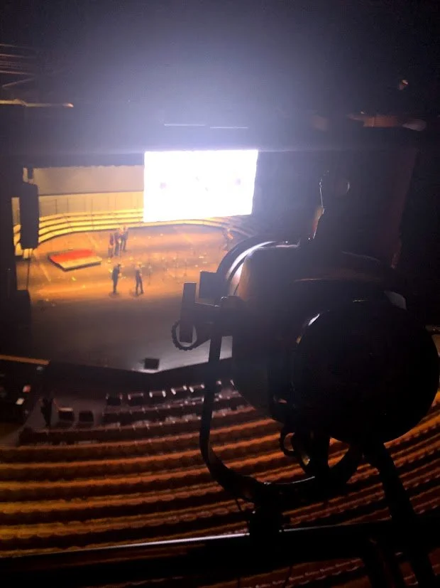Behind-the-scenes view of a live event production showcasing theatre-trained precision in technical execution and show production.
