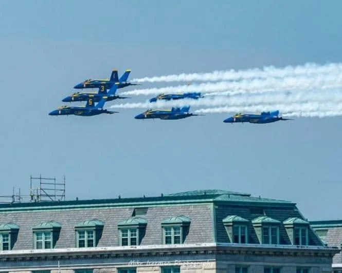 The Blue Angels soaring by at an airshow during an Elligail Charters excursion
