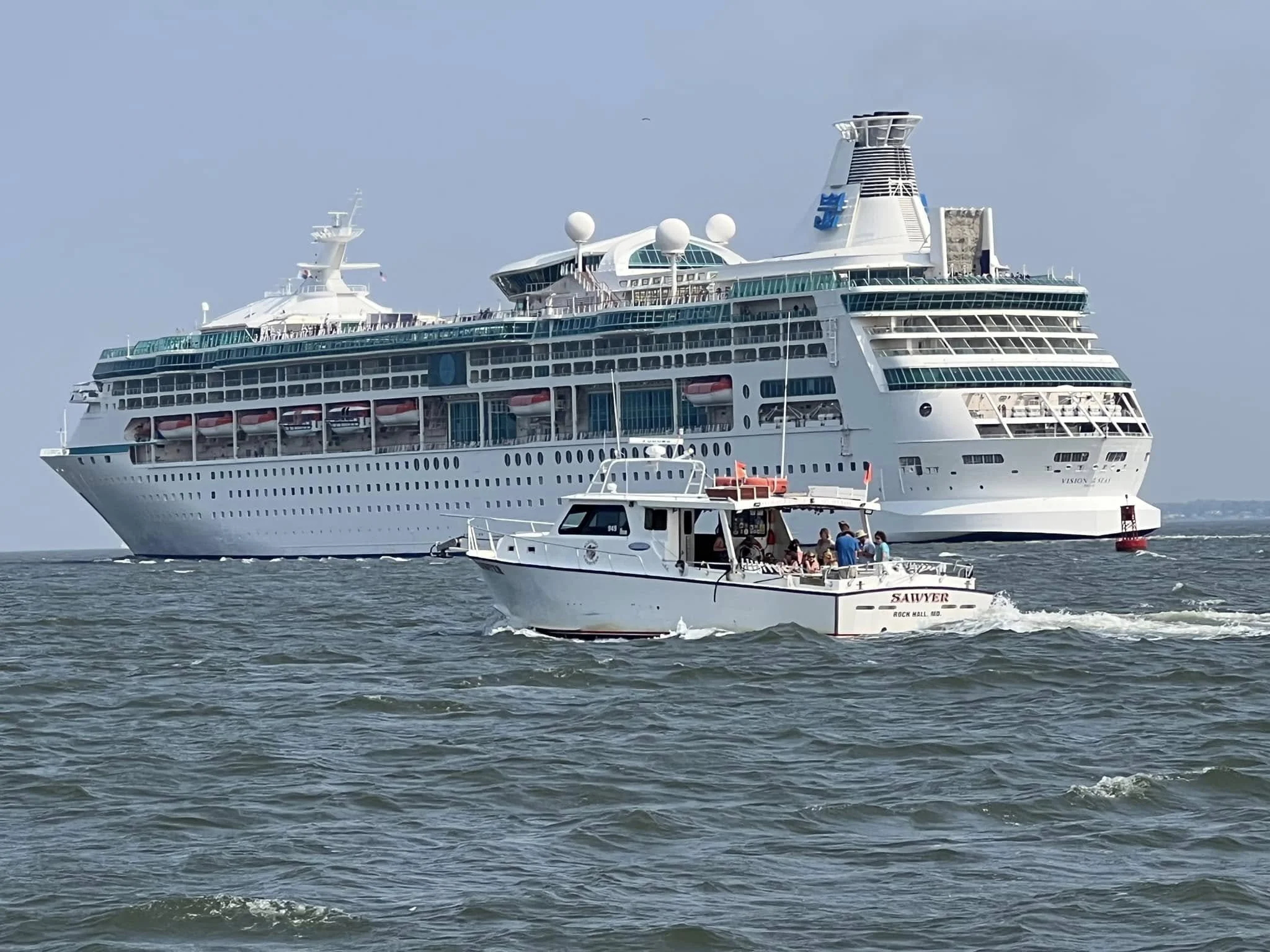 Charter boat Sawyer passing a cruise ship on an Elligail Charters excursion