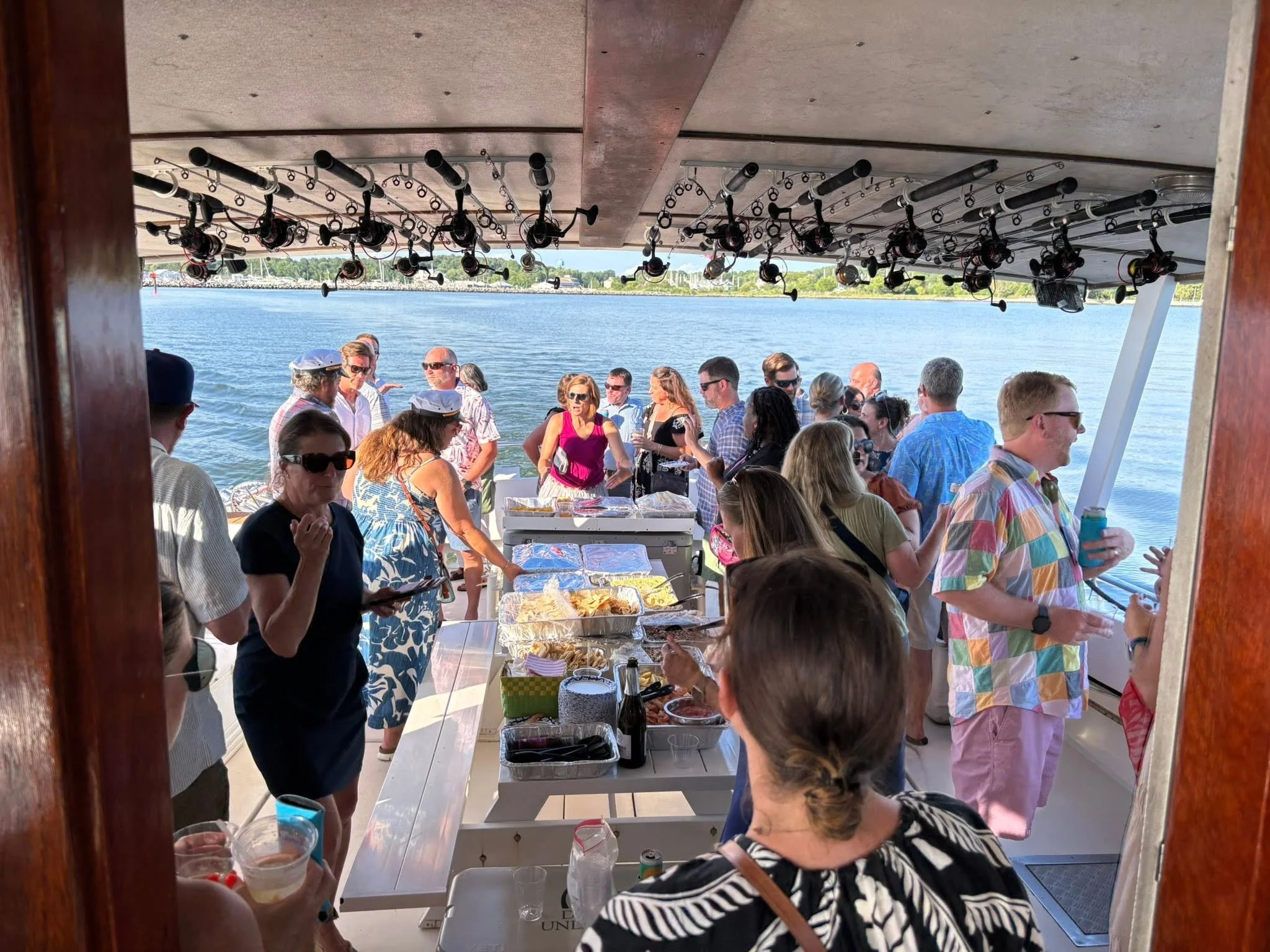 Photo of a group enjoying a meal on the charter boat Sawyer