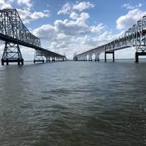 Cruising between the Chesapeake Bay Bridge spans on an Elligail Charters excursion