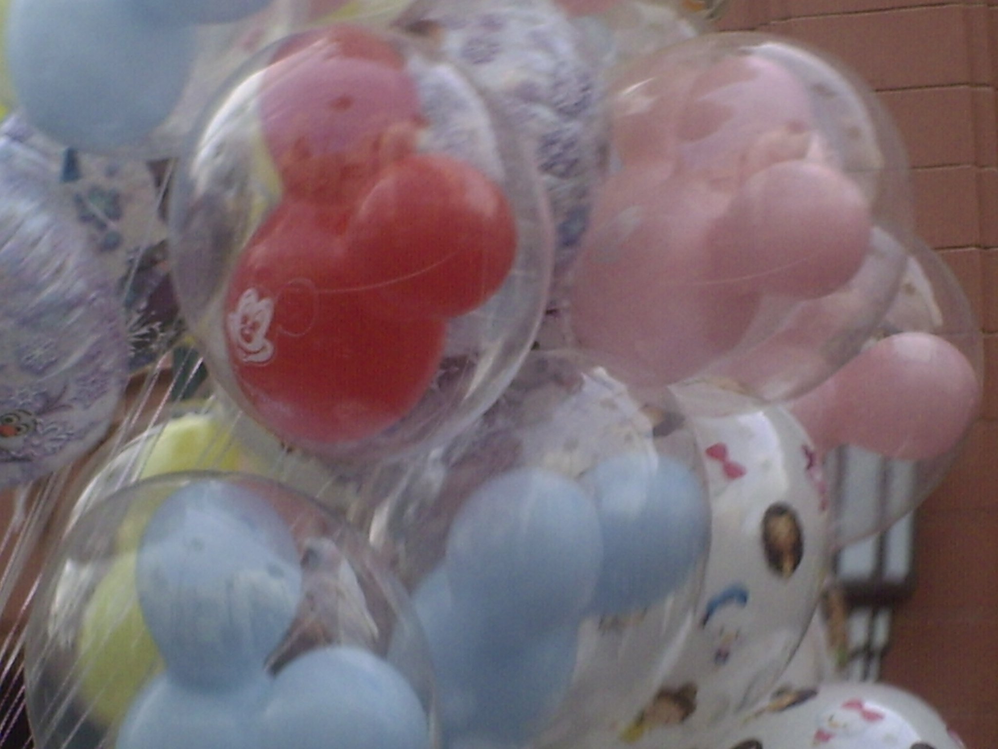Close-up of a plastic bag filled with colorful plastic eggs.