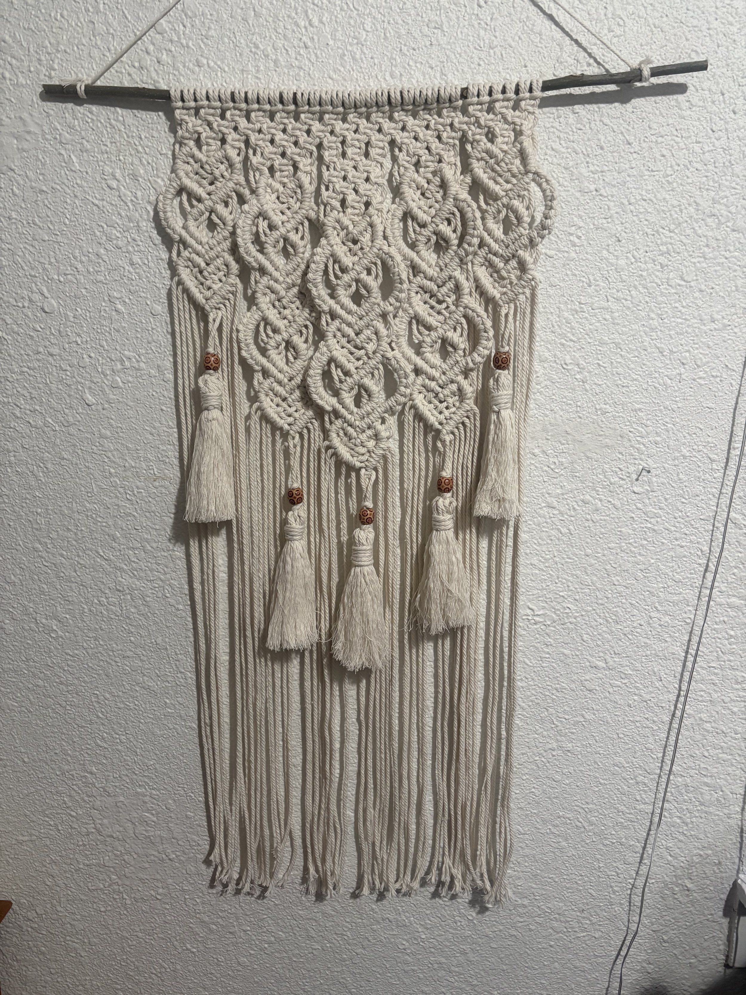 Nature's Tapestry 
(15" x 33")
Inspired by flowing water and forest textures, this wall hanging accented with beads makes a striking focal point for any room. 

$150.00