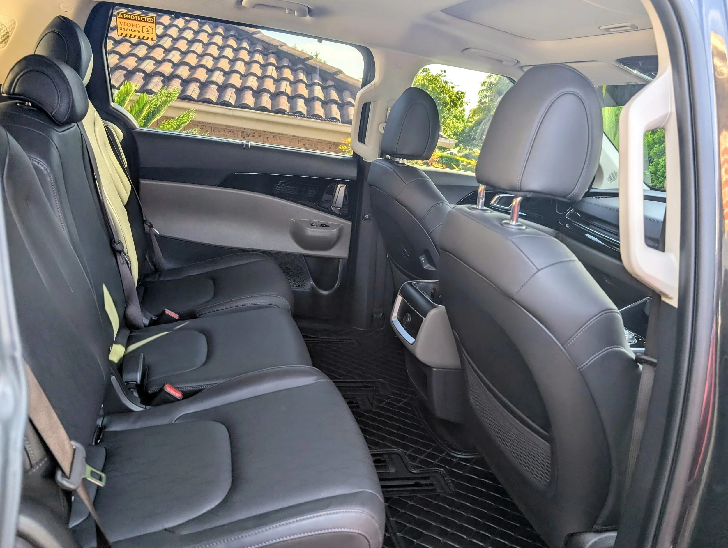 Interior view of the Kia Carnival from the sliding door, showing spacious and comfortable seating for private and assisted transport throughout Sydney.