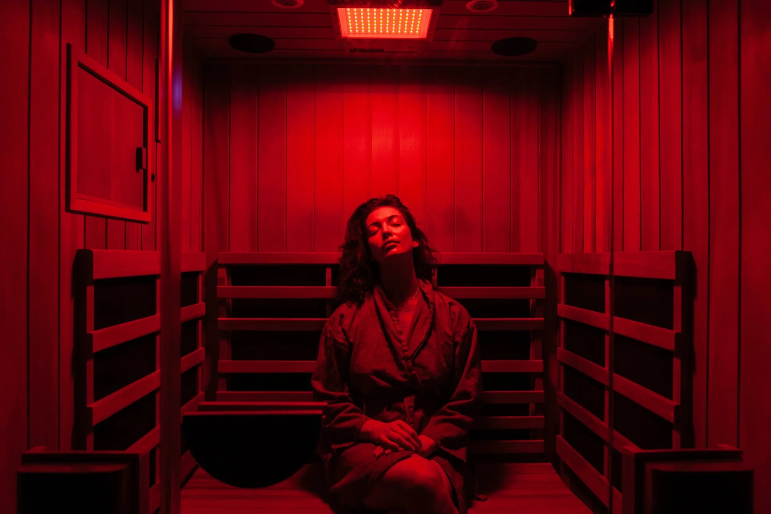 Woman relaxing during a red light therapy session