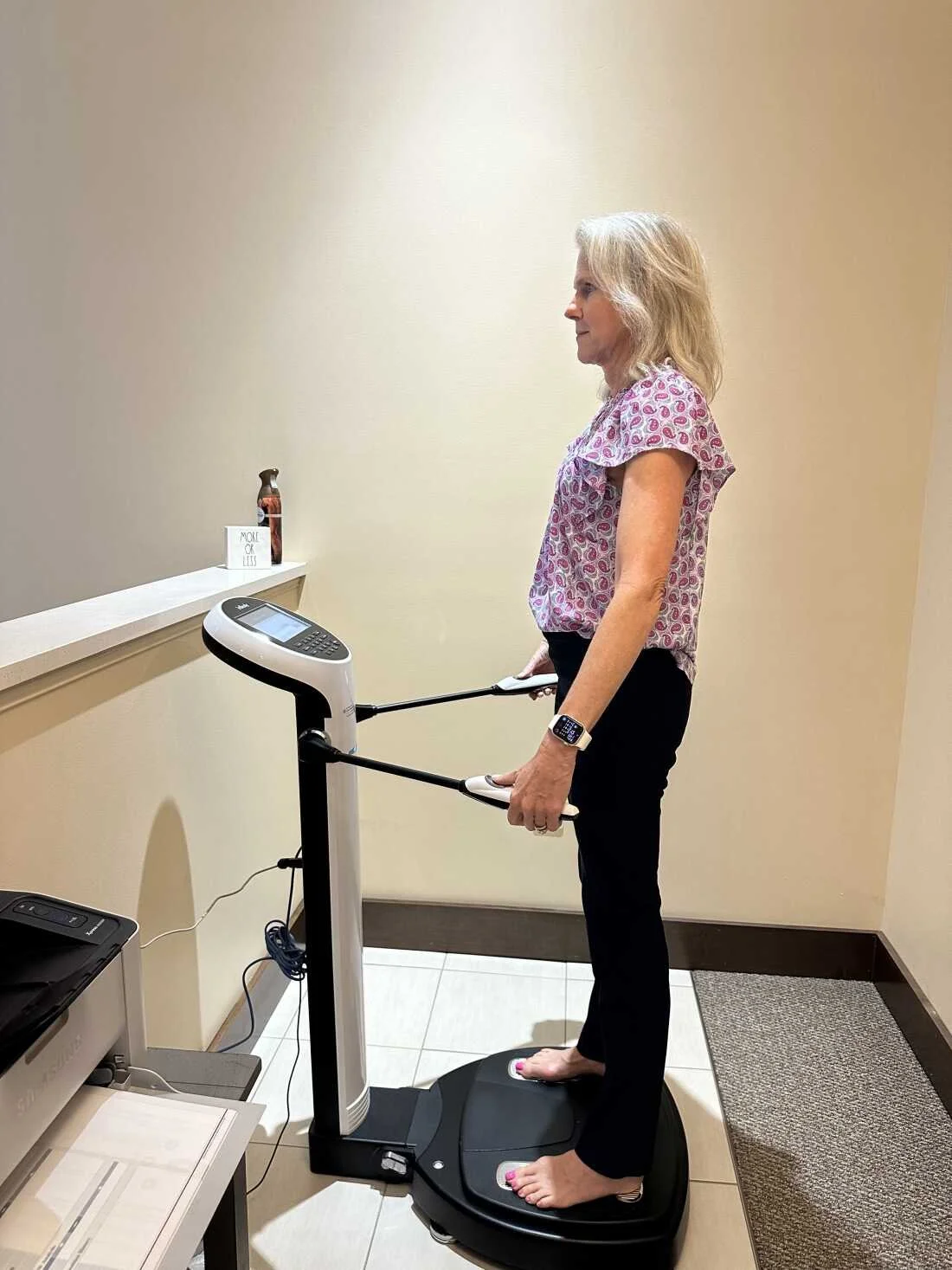 Woman completing a body composition scan