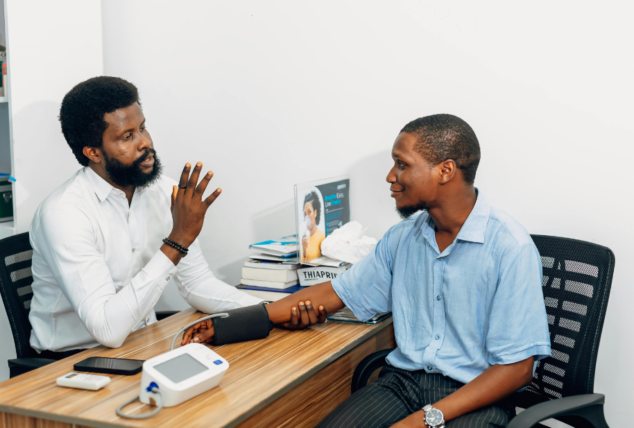 Wellness consultant checking a client’s blood pressure