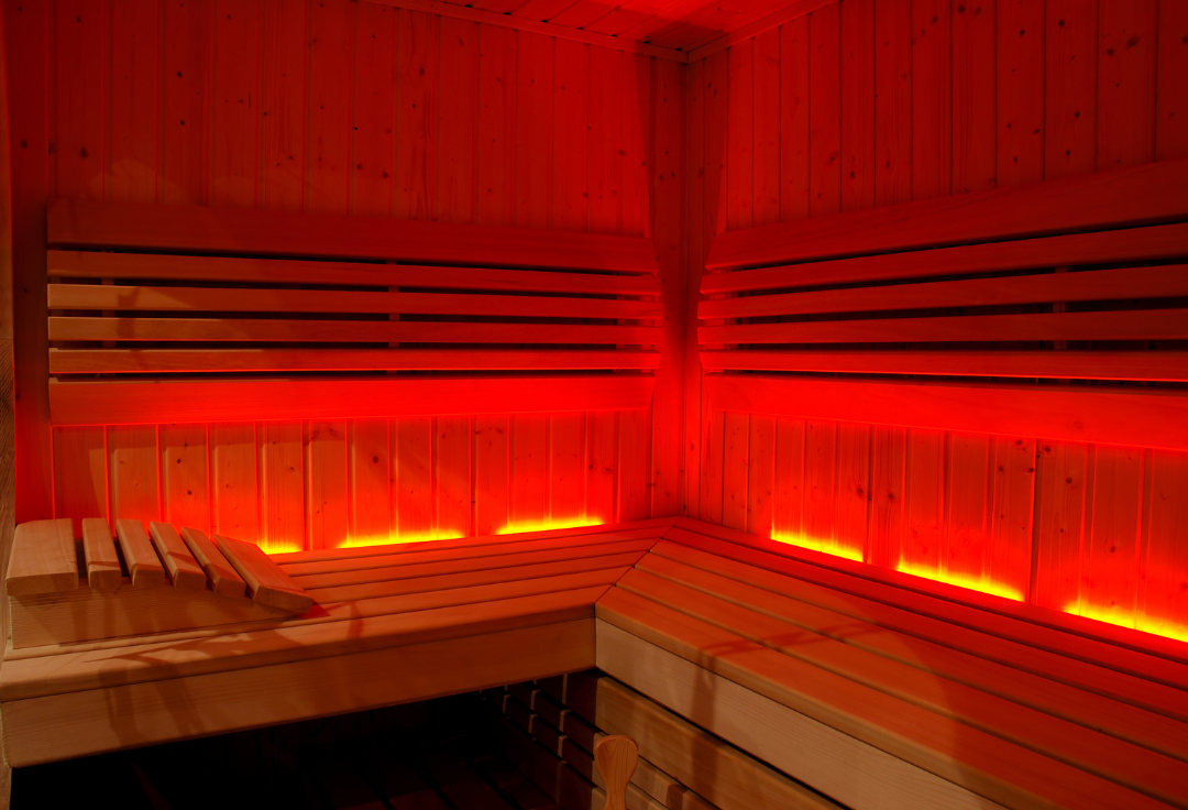 Infrared sauna room with red light at Panther Longevity