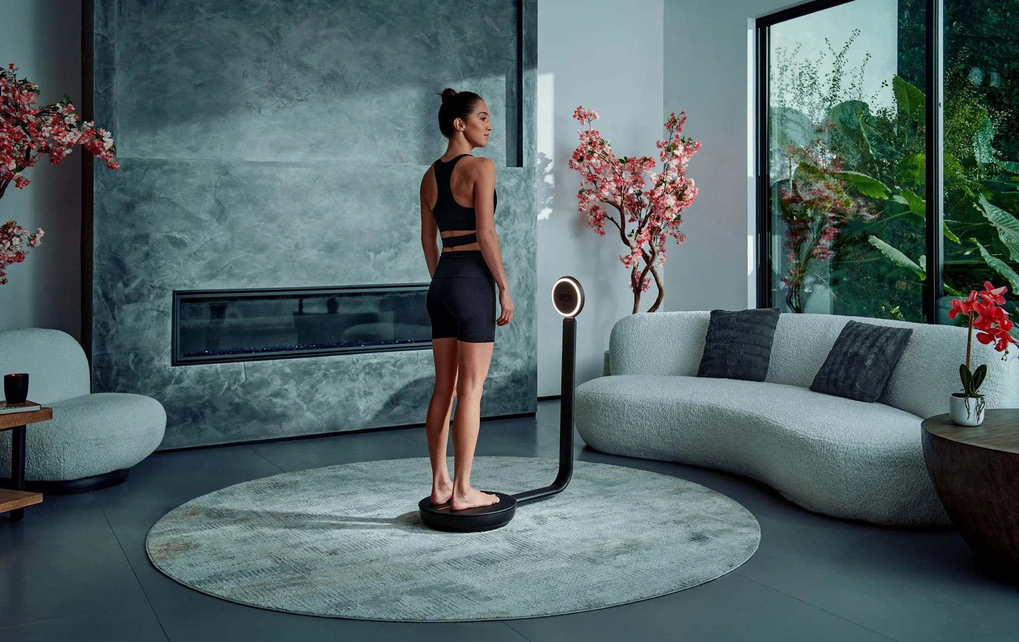 Woman using a body composition analyzer for weight-management tracking