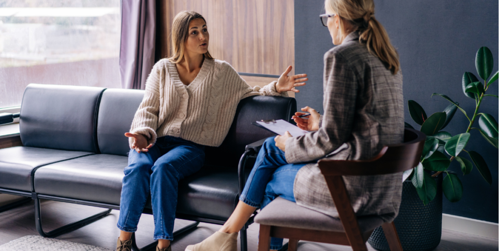 Woman discussing her goals with a wellness professional