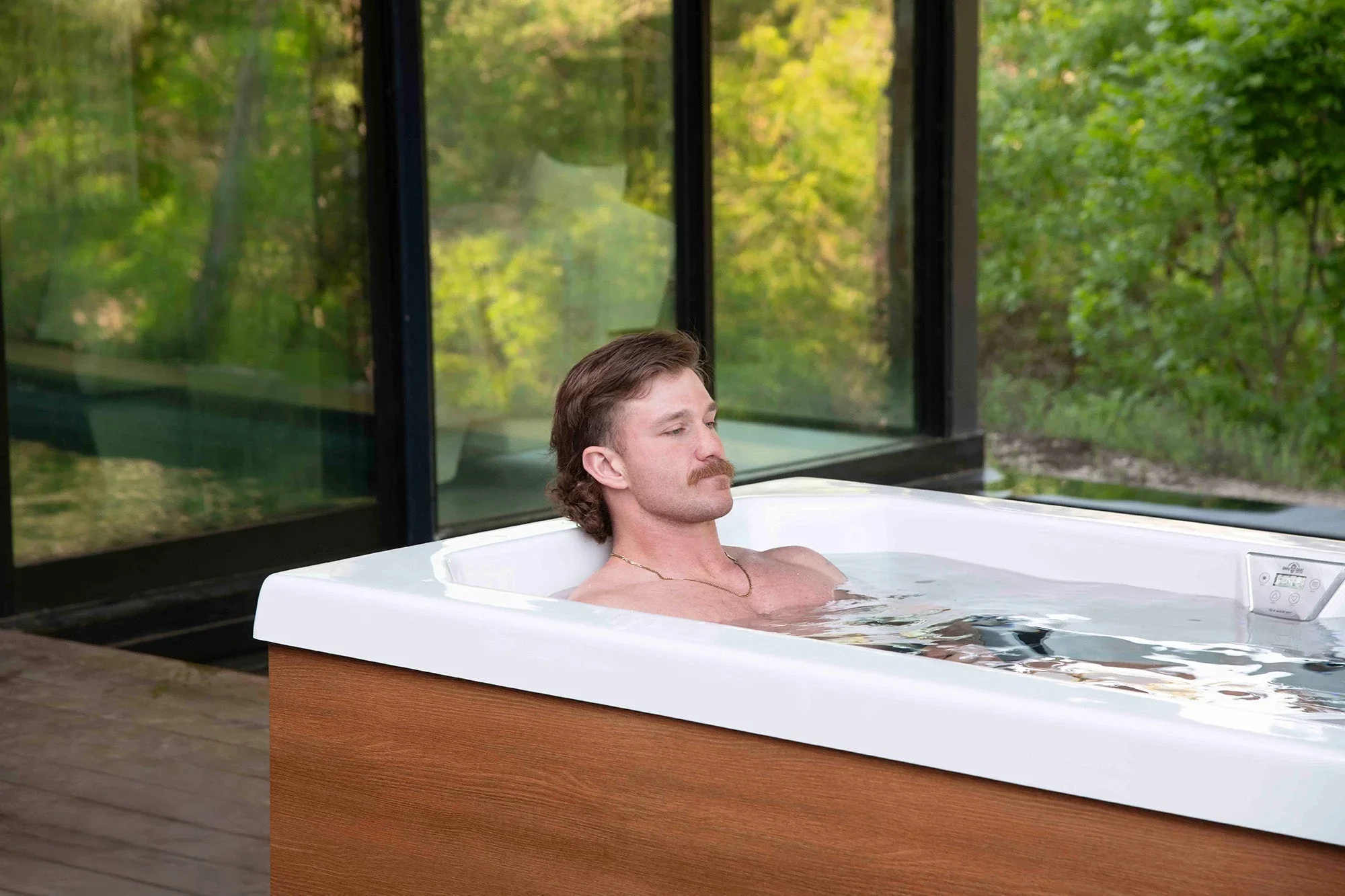 Man relaxing in a cold plunge