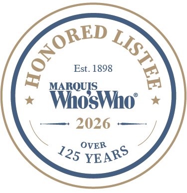 A circular badge with text indicating it is a honored list from Marquis Who's Who, established in 1898, with over 125 years of recognition, for the year 2026.