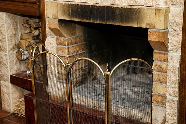 Brick fireplace with smoke staining due to venting issues.