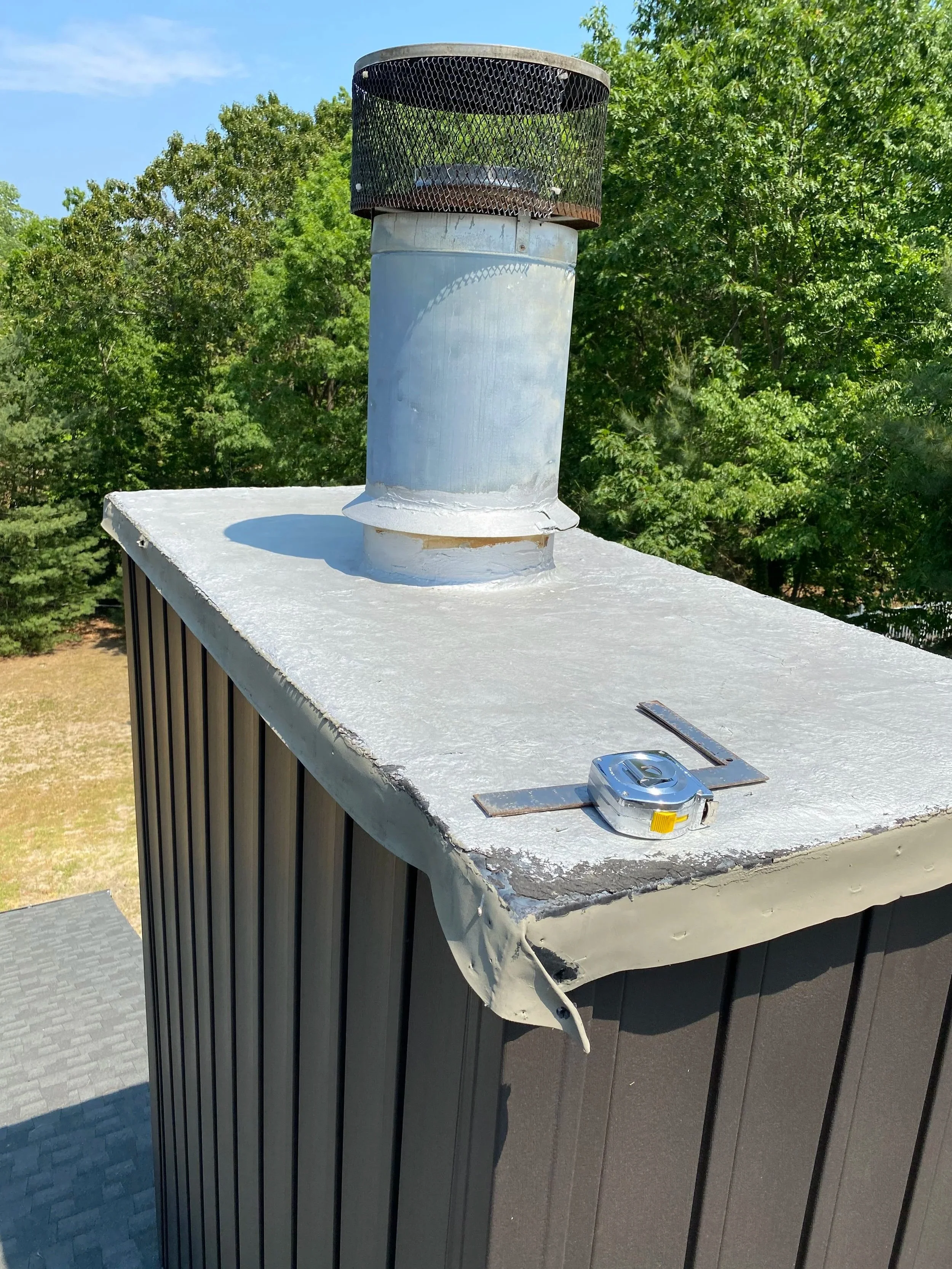 Before Custom chase cover was installed. Was sheet metal with flex seal type paste all over. Was leaking due to an improper repair.
