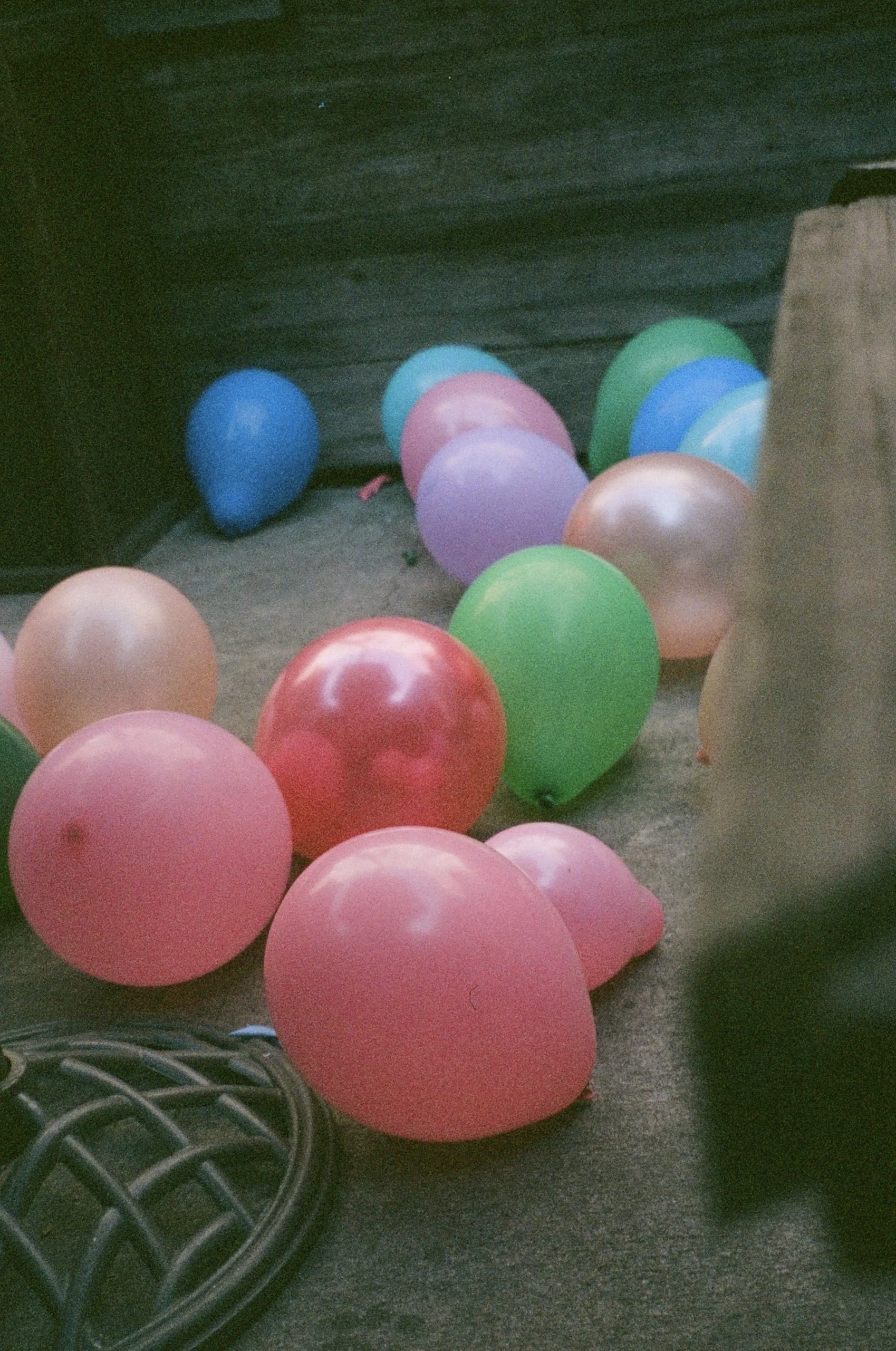 Colorful balloons scattered on the ground inside a bar. happy birthday.
