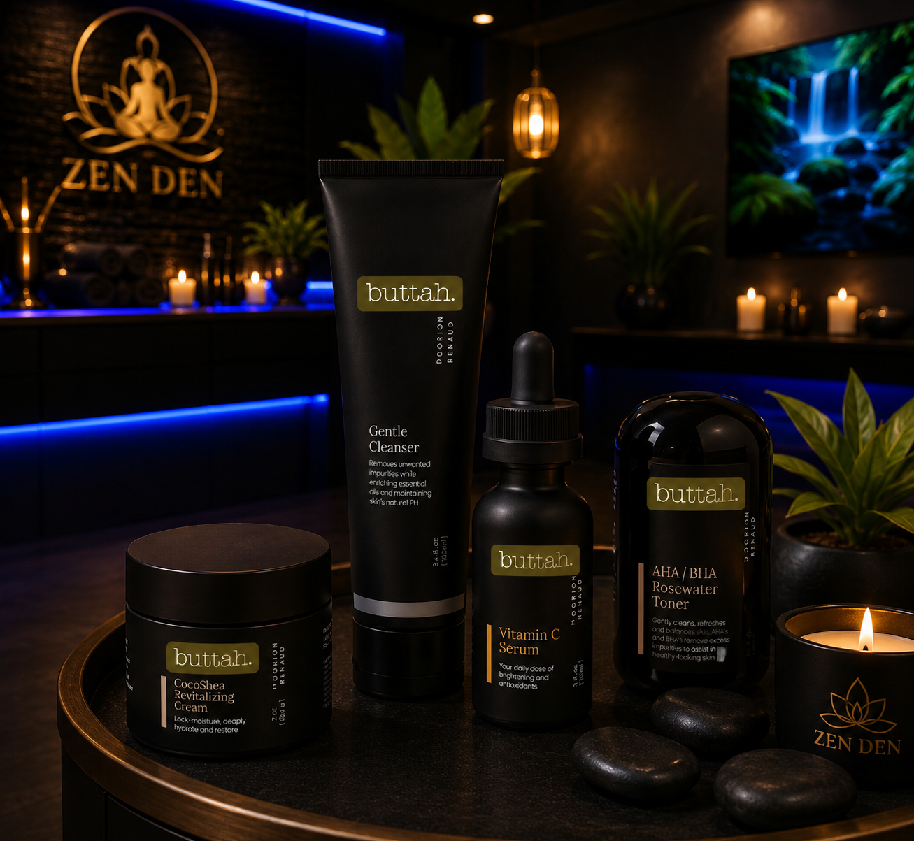 Collection of skincare products including CocoShea Revitalizing Cream, Gentle Cleanser, Vitamin C Serum, and Rosewater Toner on a black round table in a zen-themed room with dim lighting, candles, plants, and a framed logo that reads 'ZEN DEN' in the background.