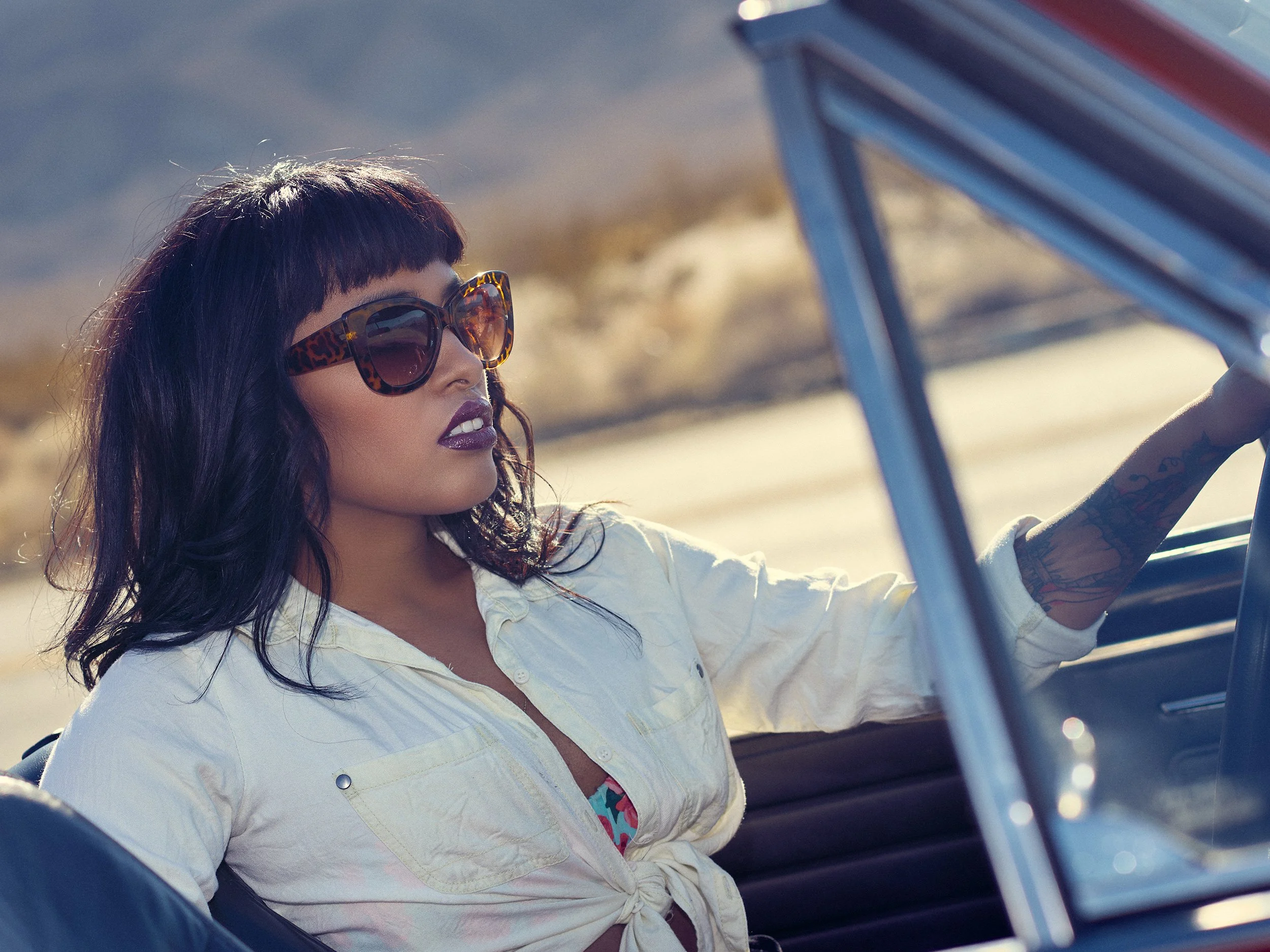 Fashion portrait of Lisa Jennigs photographed inside a vintage convertible for WESTBOUND in Anza-Borrego.
